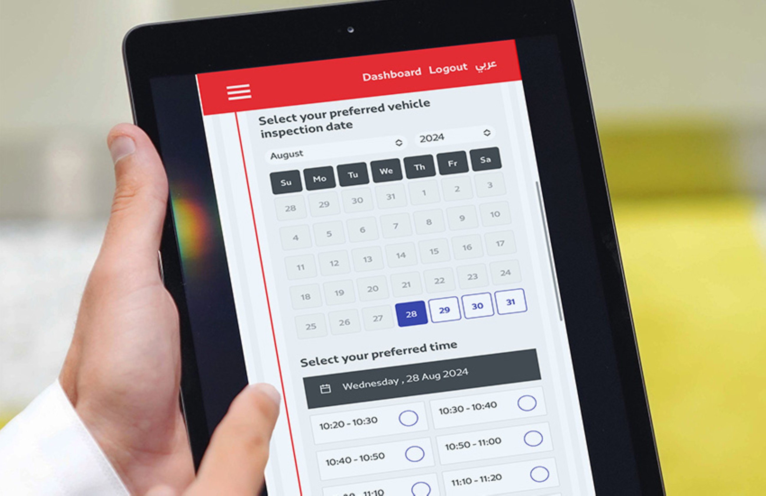 An official explains the online appointments system to motorists in Dubai. 