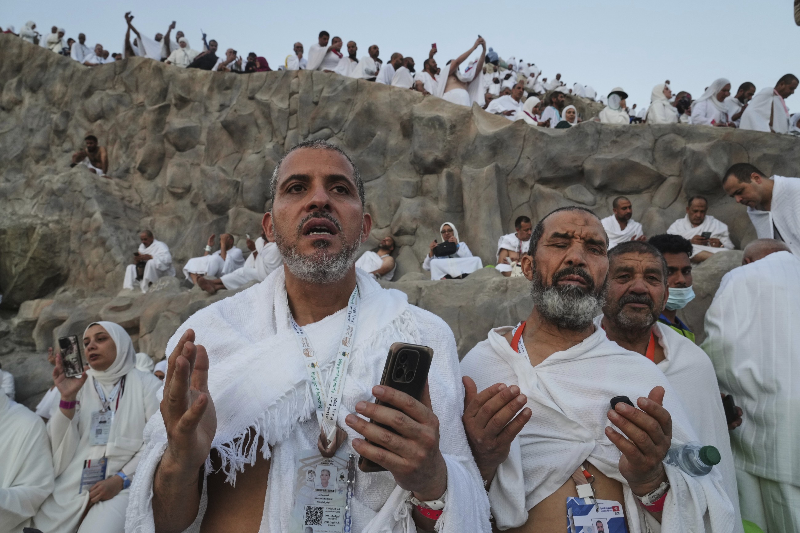 Muslim pilgrims pray at Mount Arafat in Hajj apex