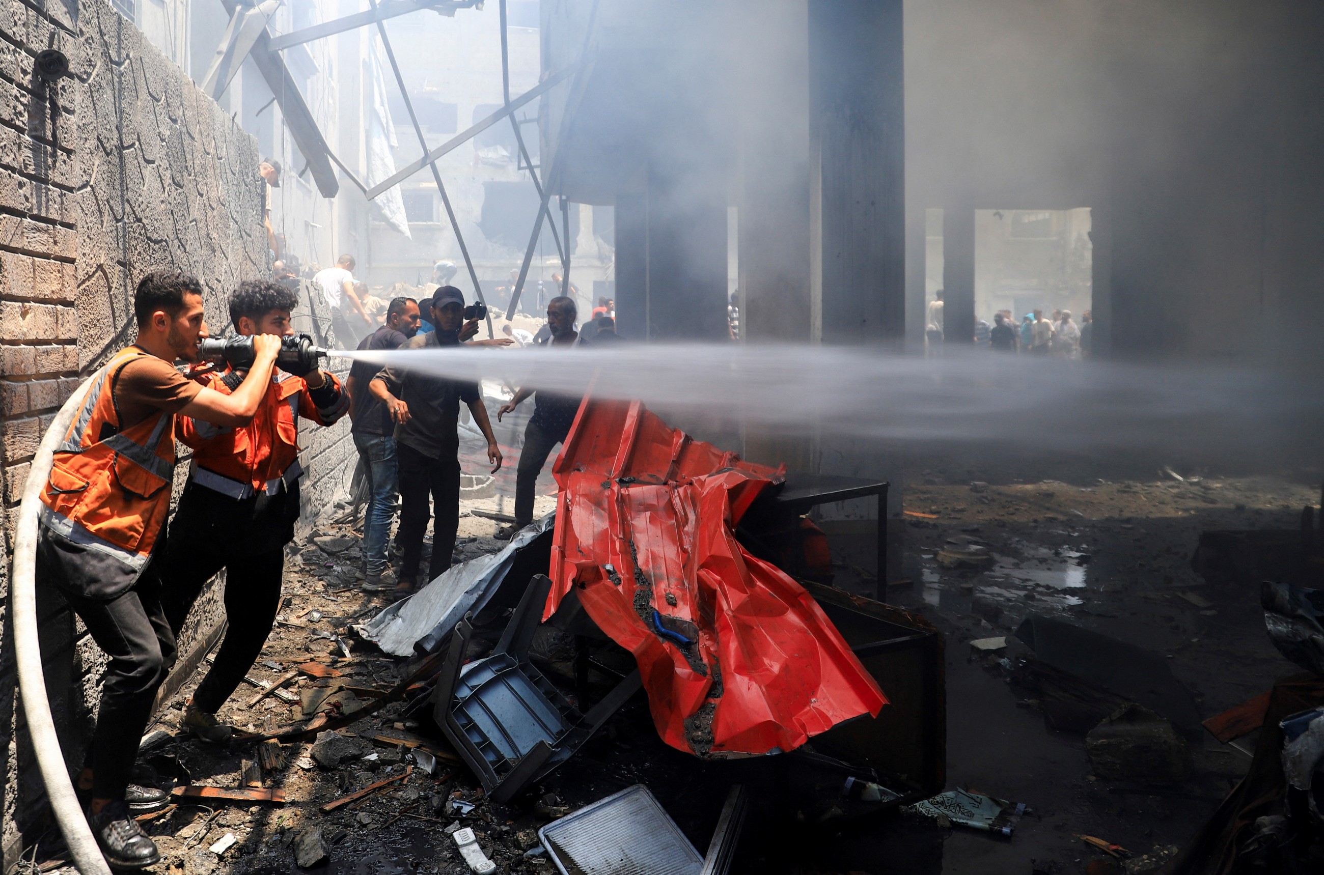 Gaza rescuers say Israel fire kills 36, six of them near aid centre