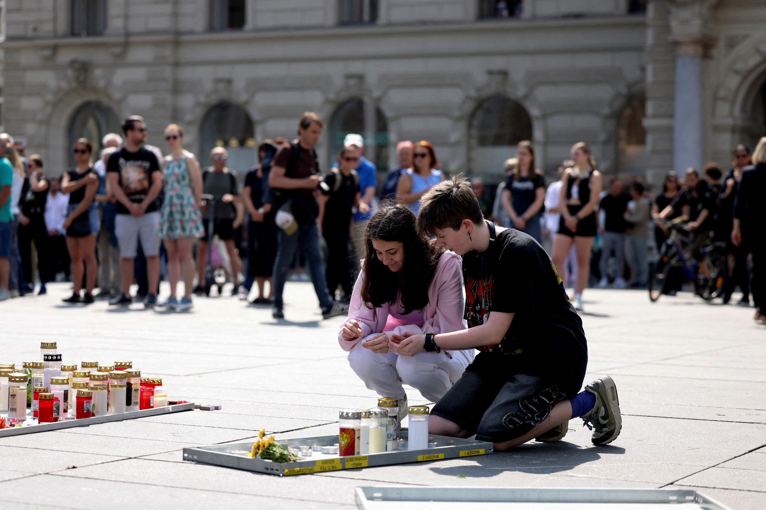 Austria falls silent for a minute as questions remain about the motive for a deadly school shooting