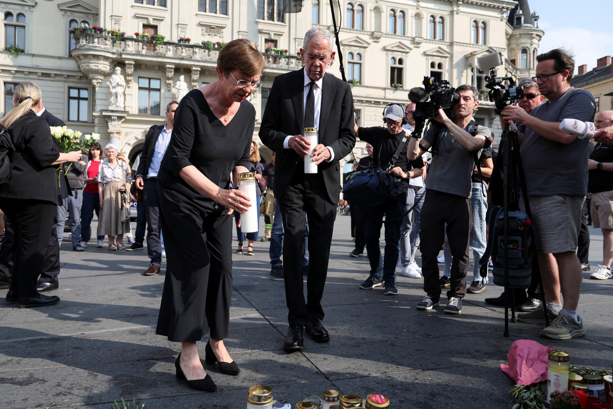 Austria falls silent for a minute as questions remain about the motive for a deadly school shooting