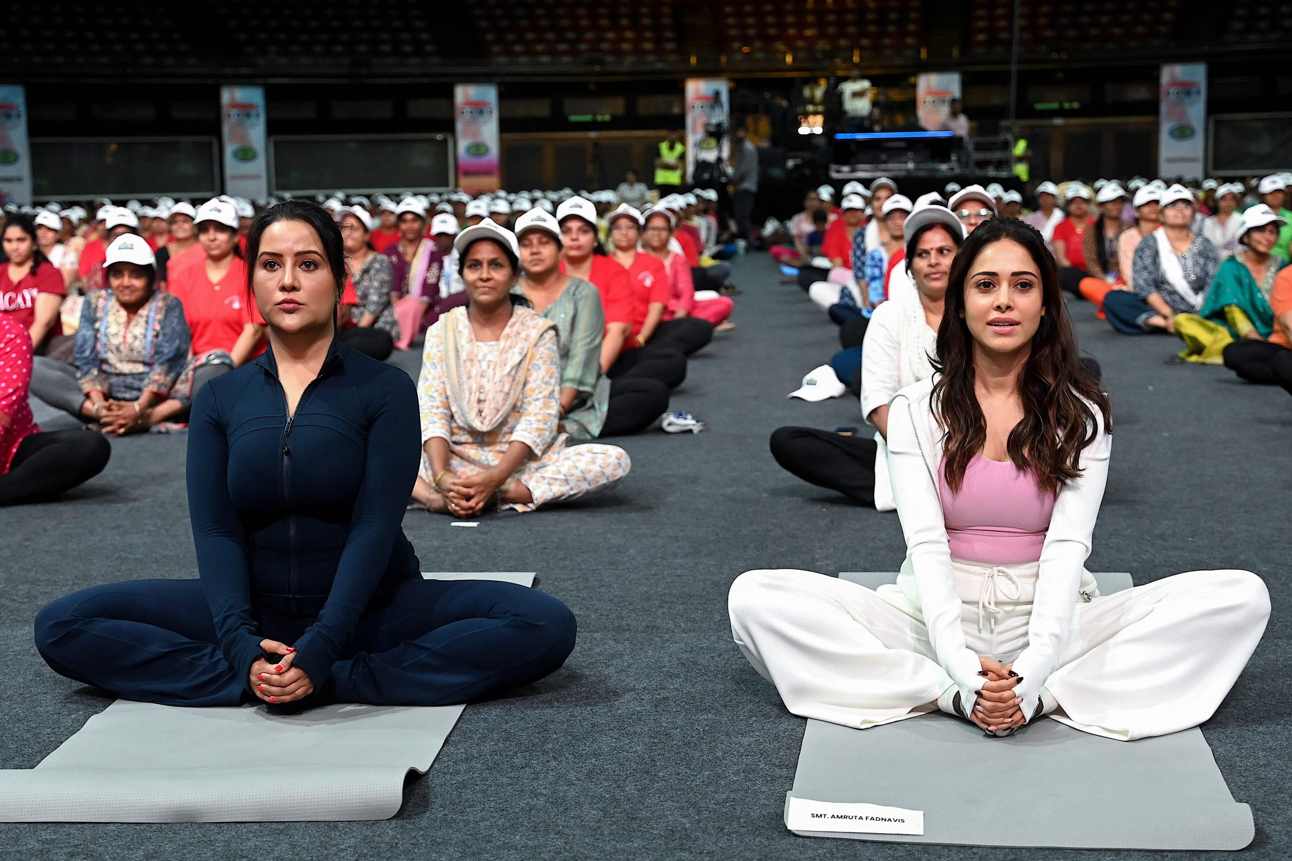 Tens of thousands of enthusiasts stretch, breathe and balance to mark International Day of Yoga