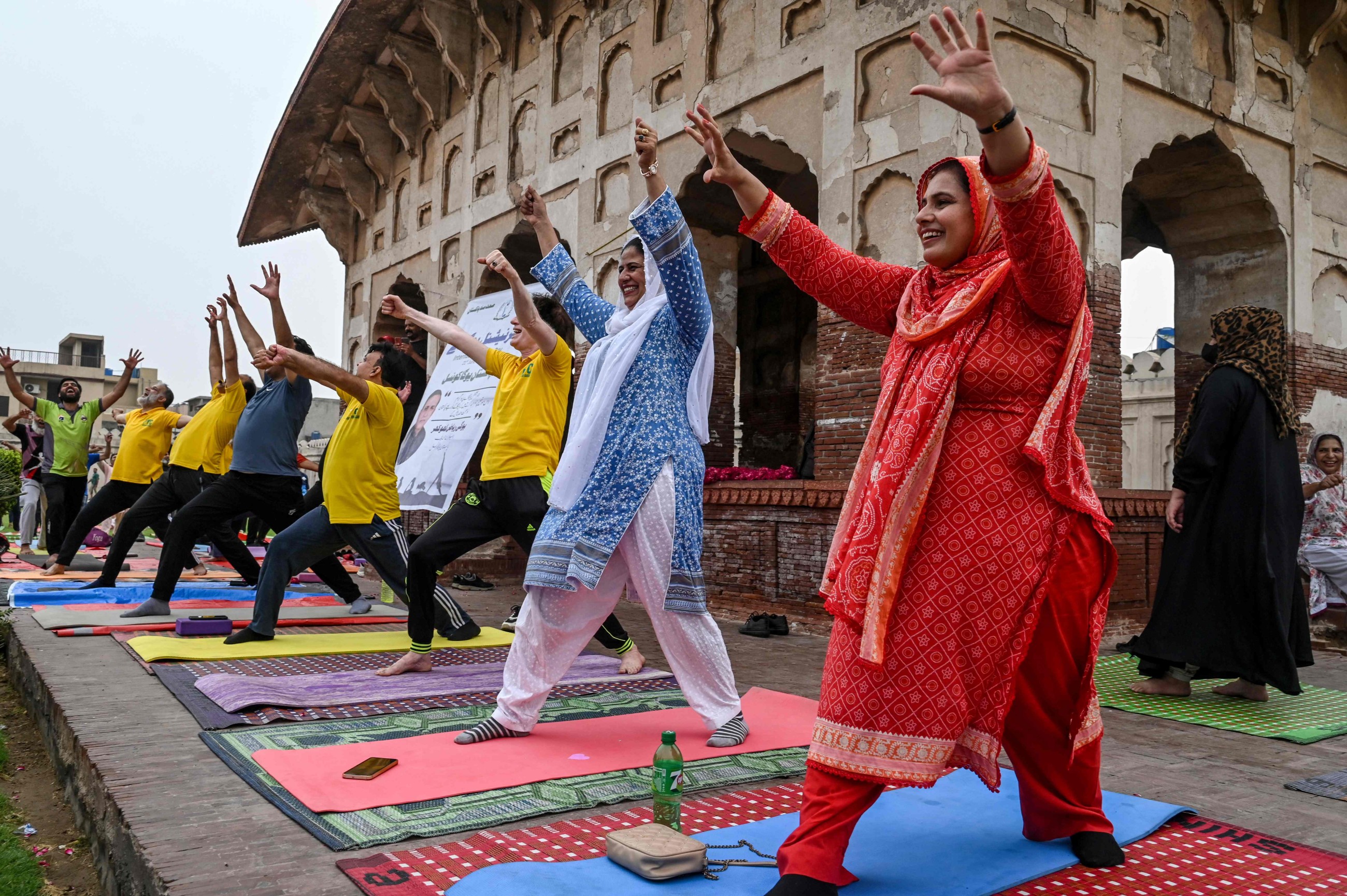 Tens of thousands of enthusiasts stretch, breathe and balance to mark International Day of Yoga