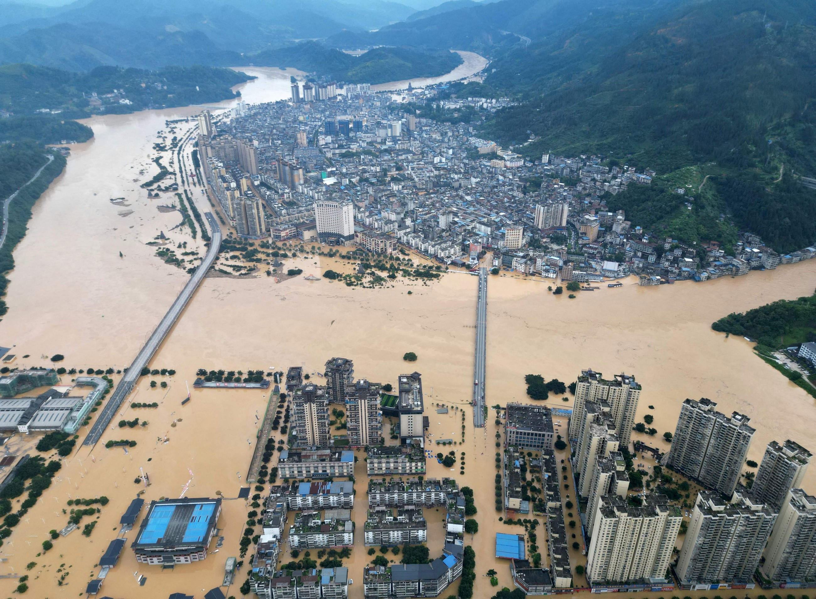 Massive floods force tens of thousands to evacuate in China