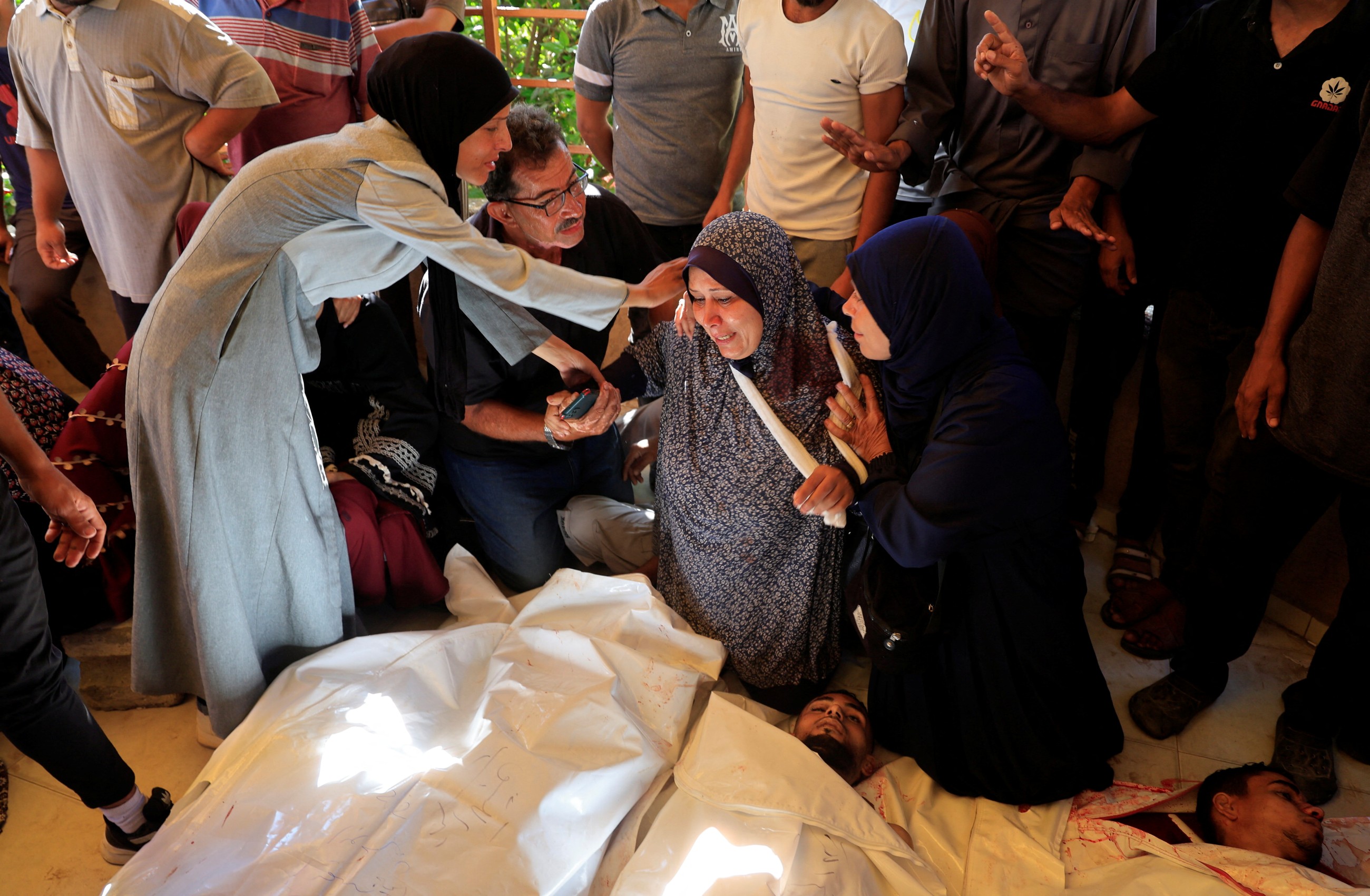 Spanish PM alleges 'genocide' in Gaza as rescuers say 56 more Palestinians killed by Israeli forces