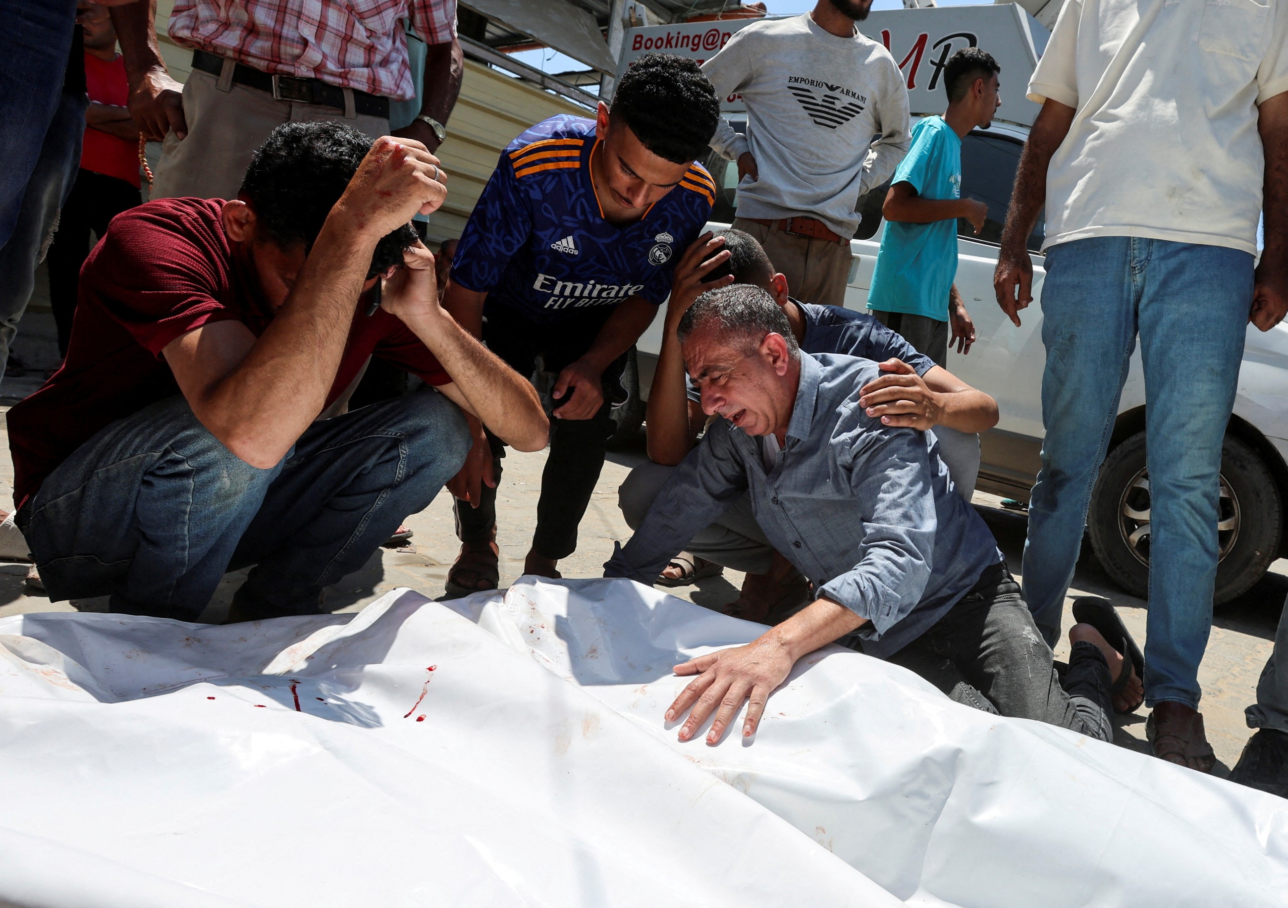 Spanish PM alleges 'genocide' in Gaza as rescuers say 56 more Palestinians killed by Israeli forces