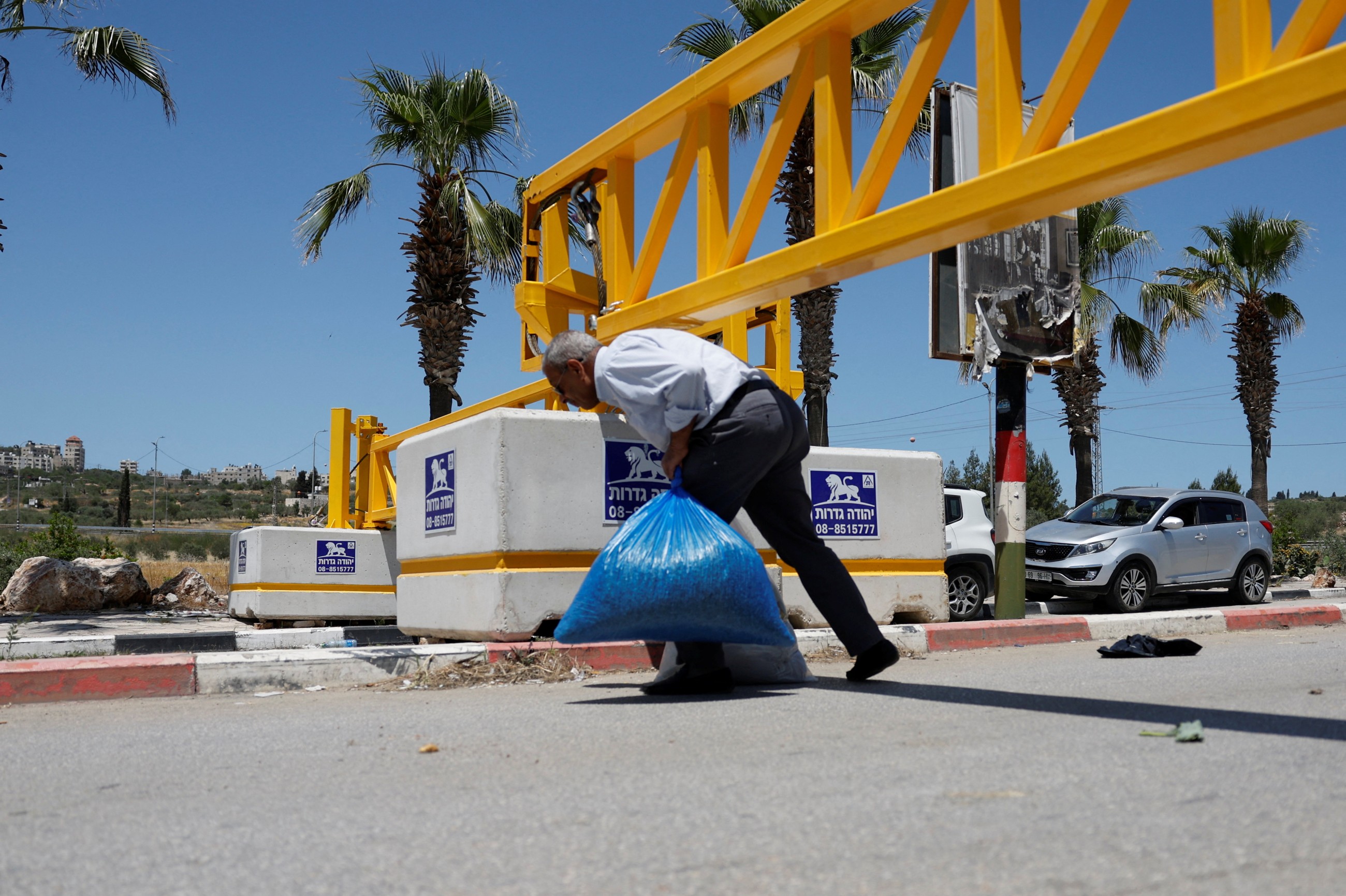 West Bank town becomes 'big prison' as Israel fences it in