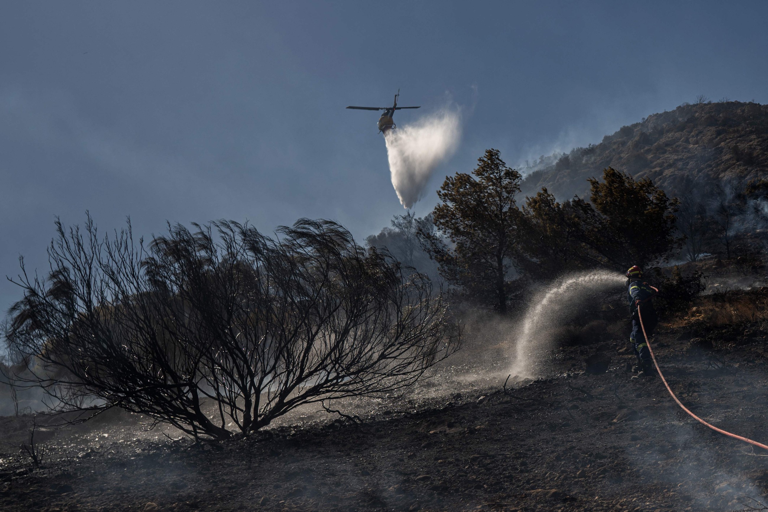 Greece battles wildfire for a third day as temperatures rise