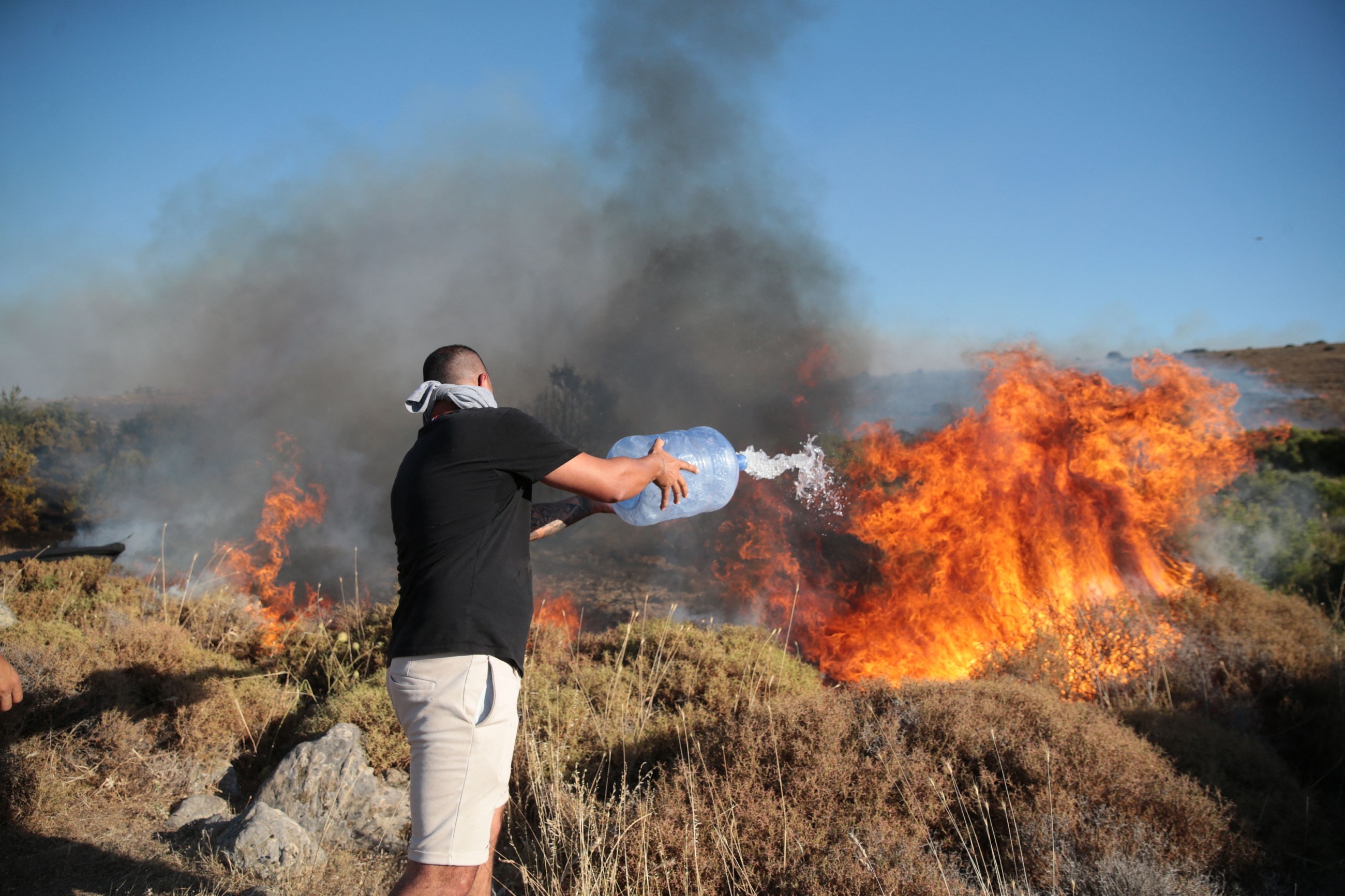 Greece battles wildfire for a third day as temperatures rise
