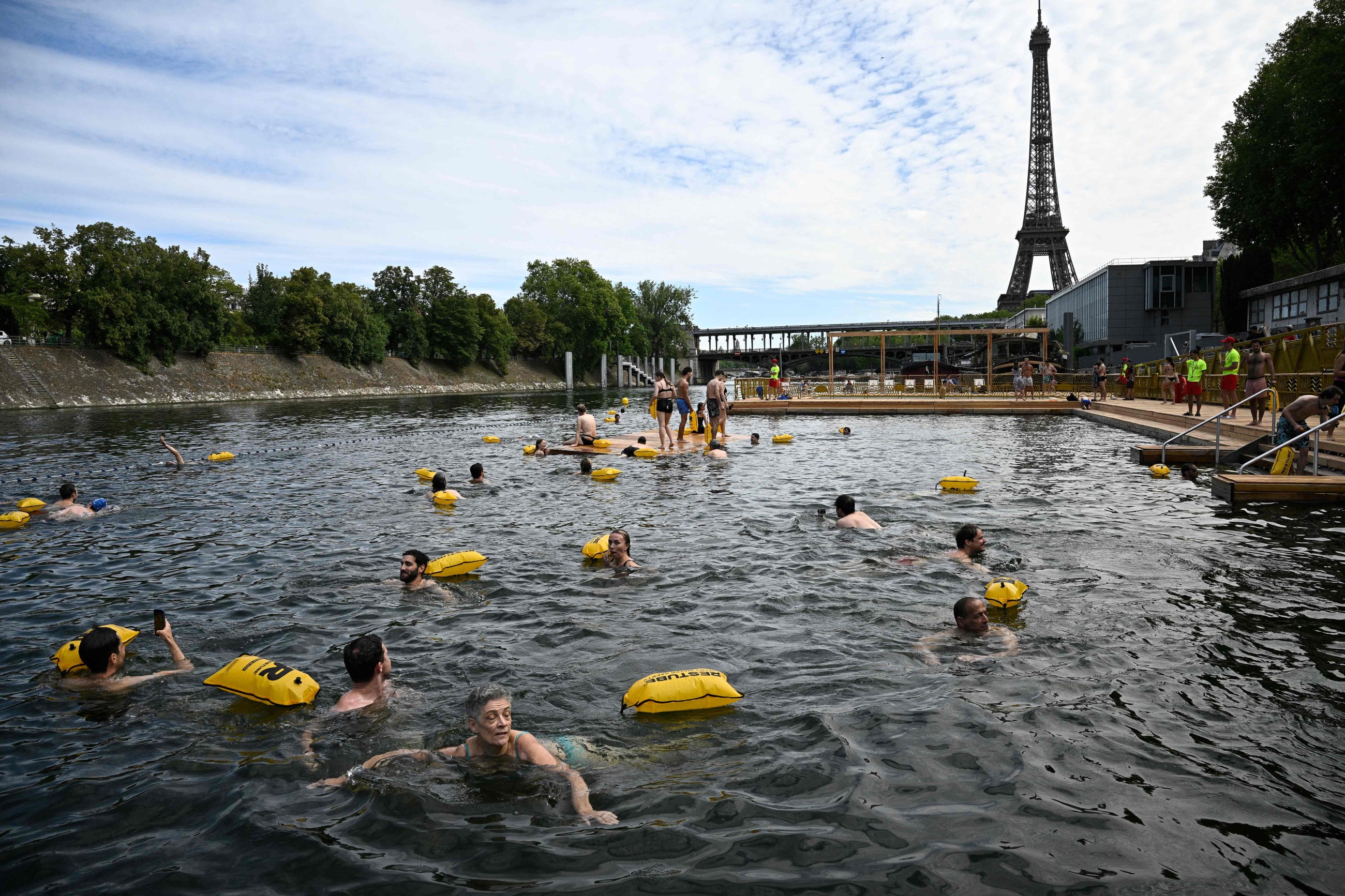 Happy swimmers cool off in Paris' Seine river after 100-year ban lifted