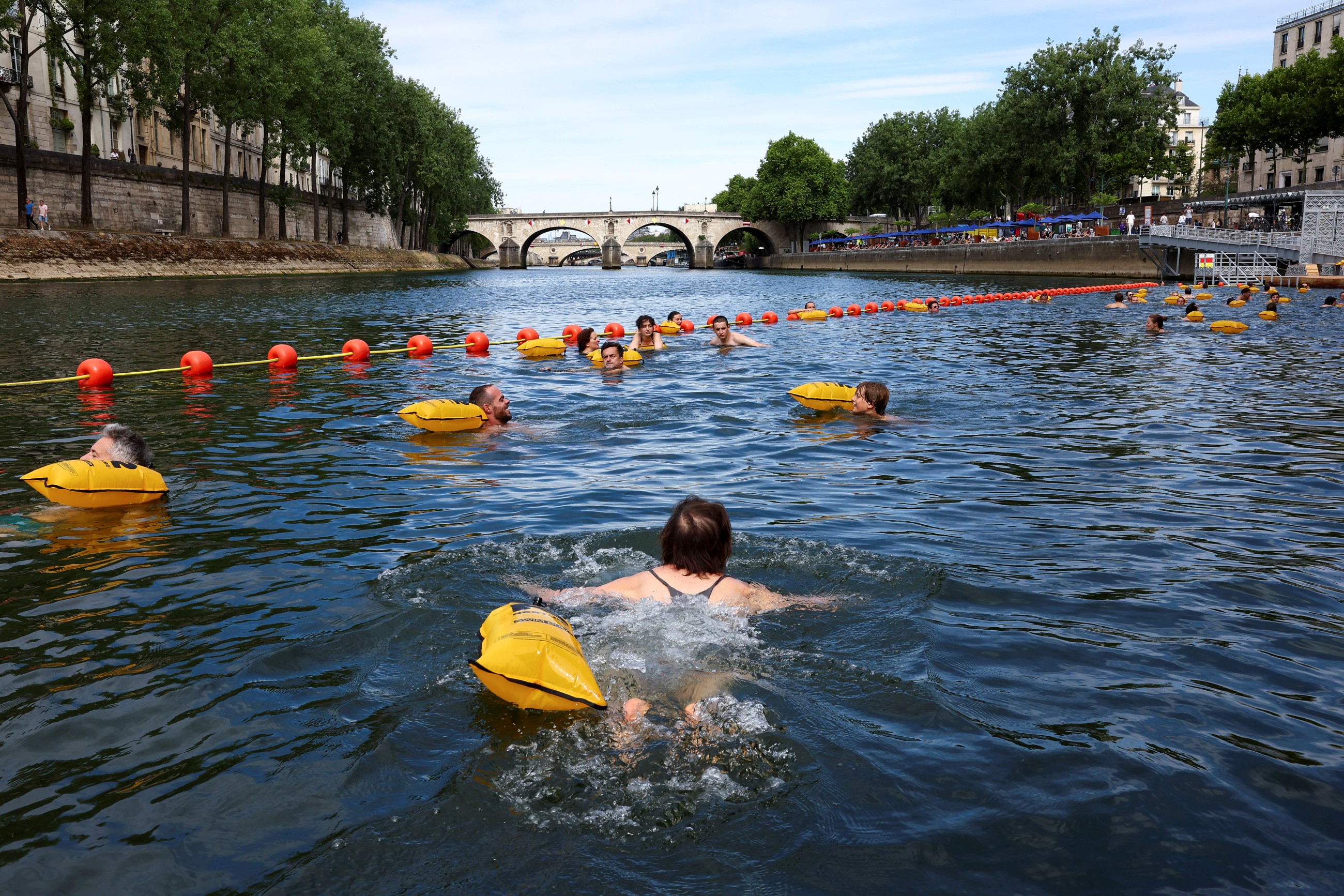 Happy swimmers cool off in Paris' Seine river after 100-year ban lifted