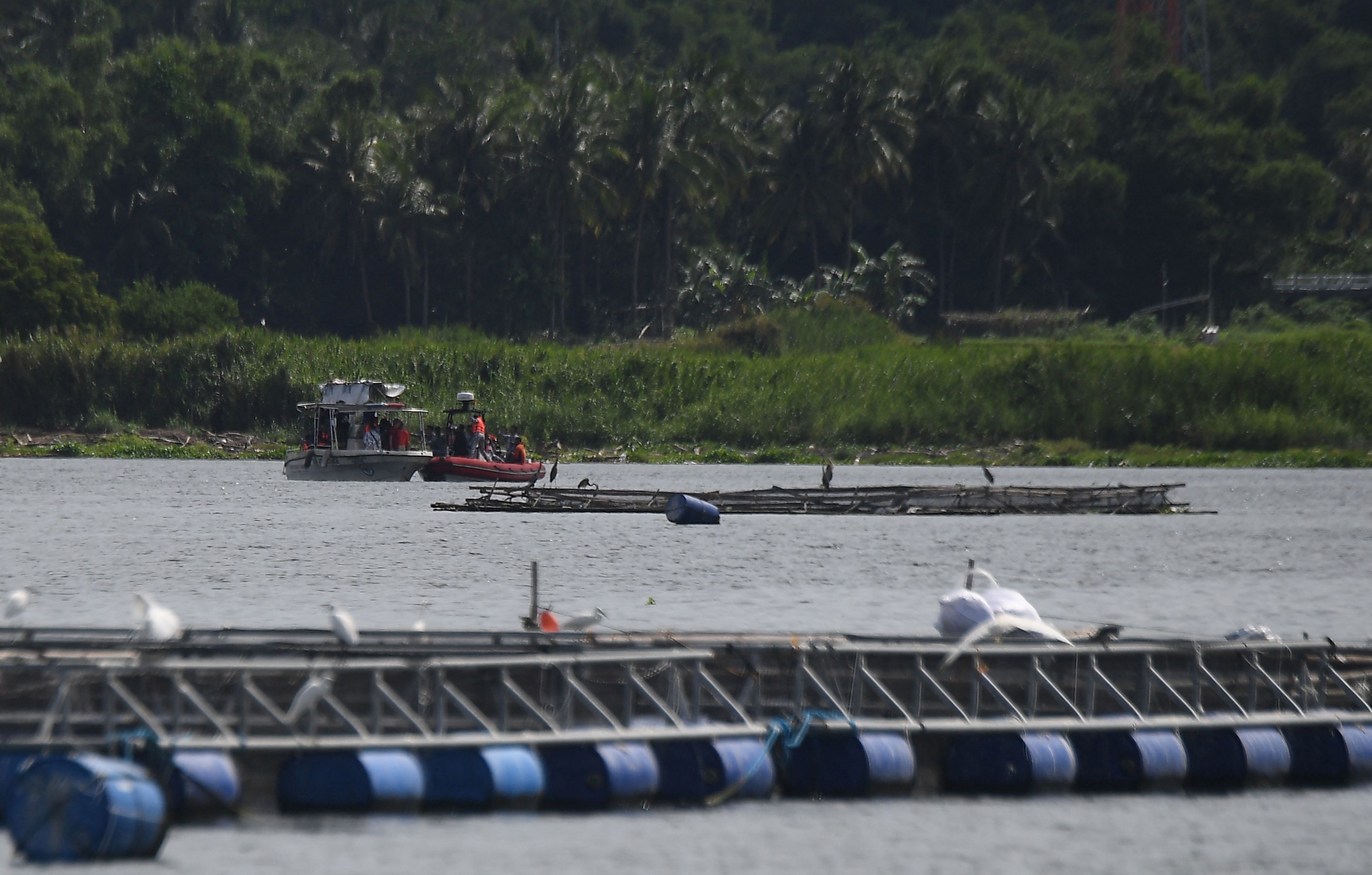 Search for missing cockfighters begins at Philippine lake