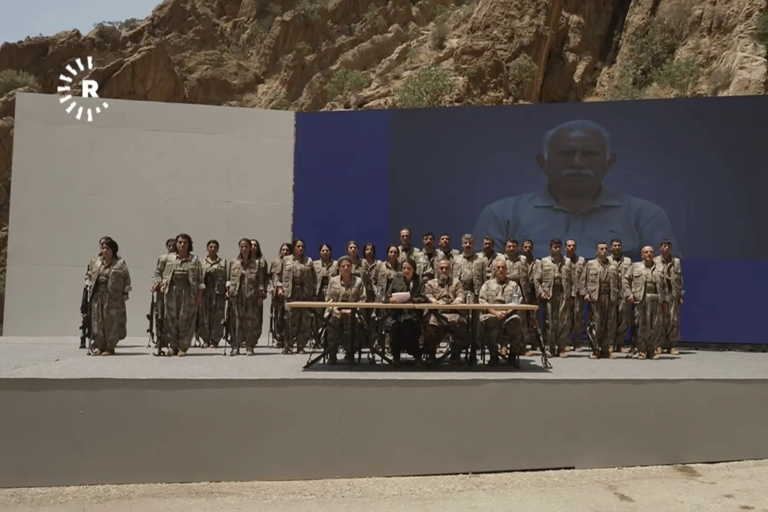 Kurdish PKK fighters destroy their weapons at disarmament ceremony