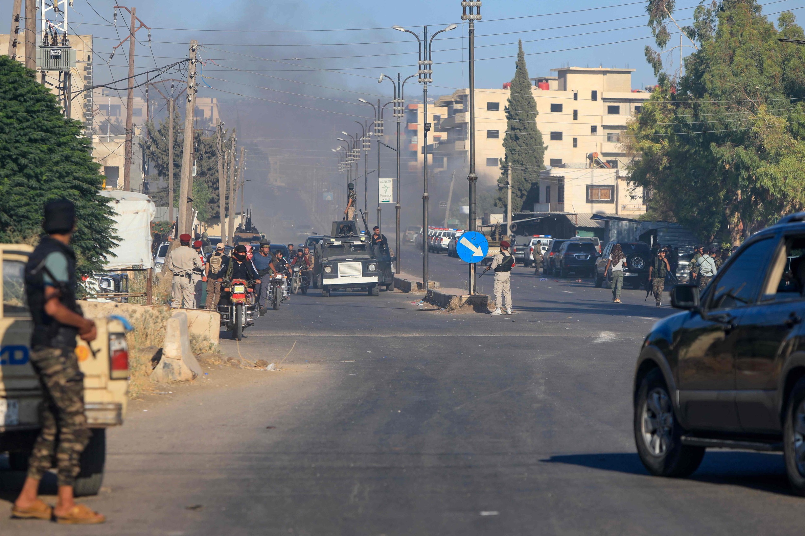 Israel strikes military tanks in Syria, where government forces clash with Druze militias
