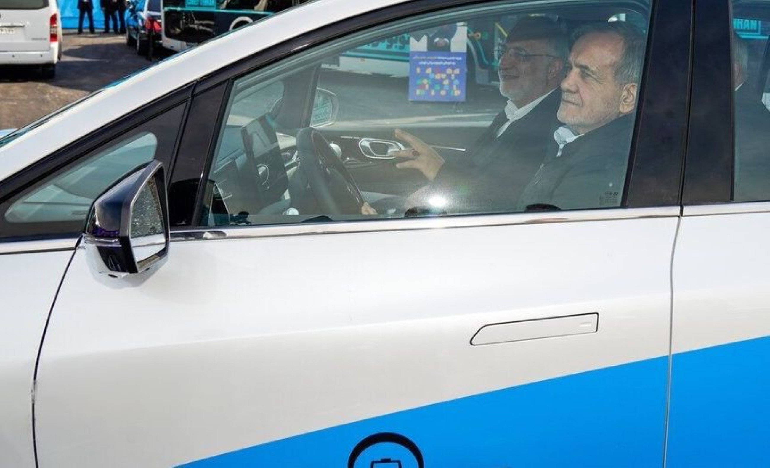Iranian president takes taxi after convoy breaks down due to tainted fuel
