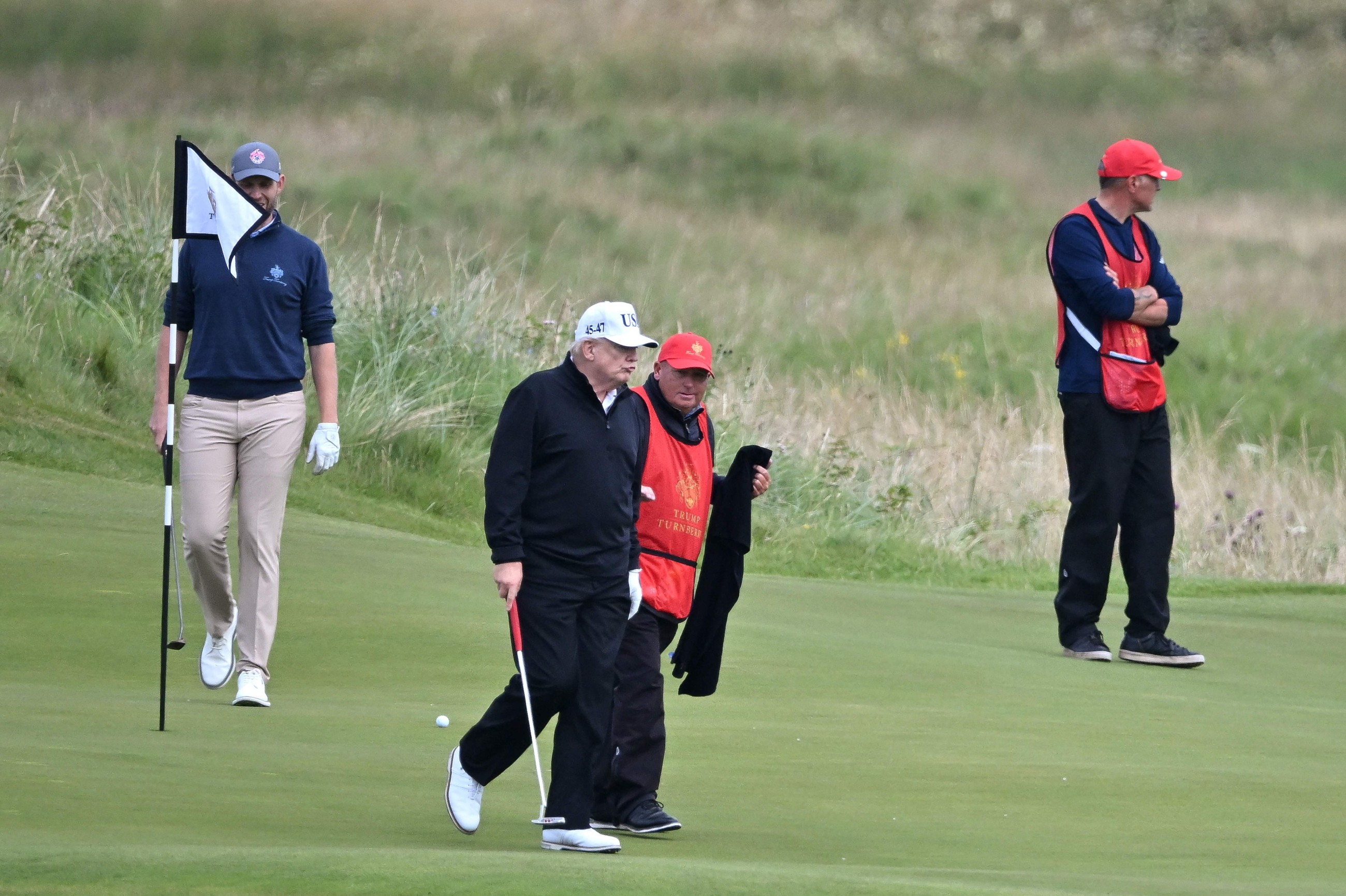 Trump plays golf in Scotland while protesters take to the streets and decry his visit