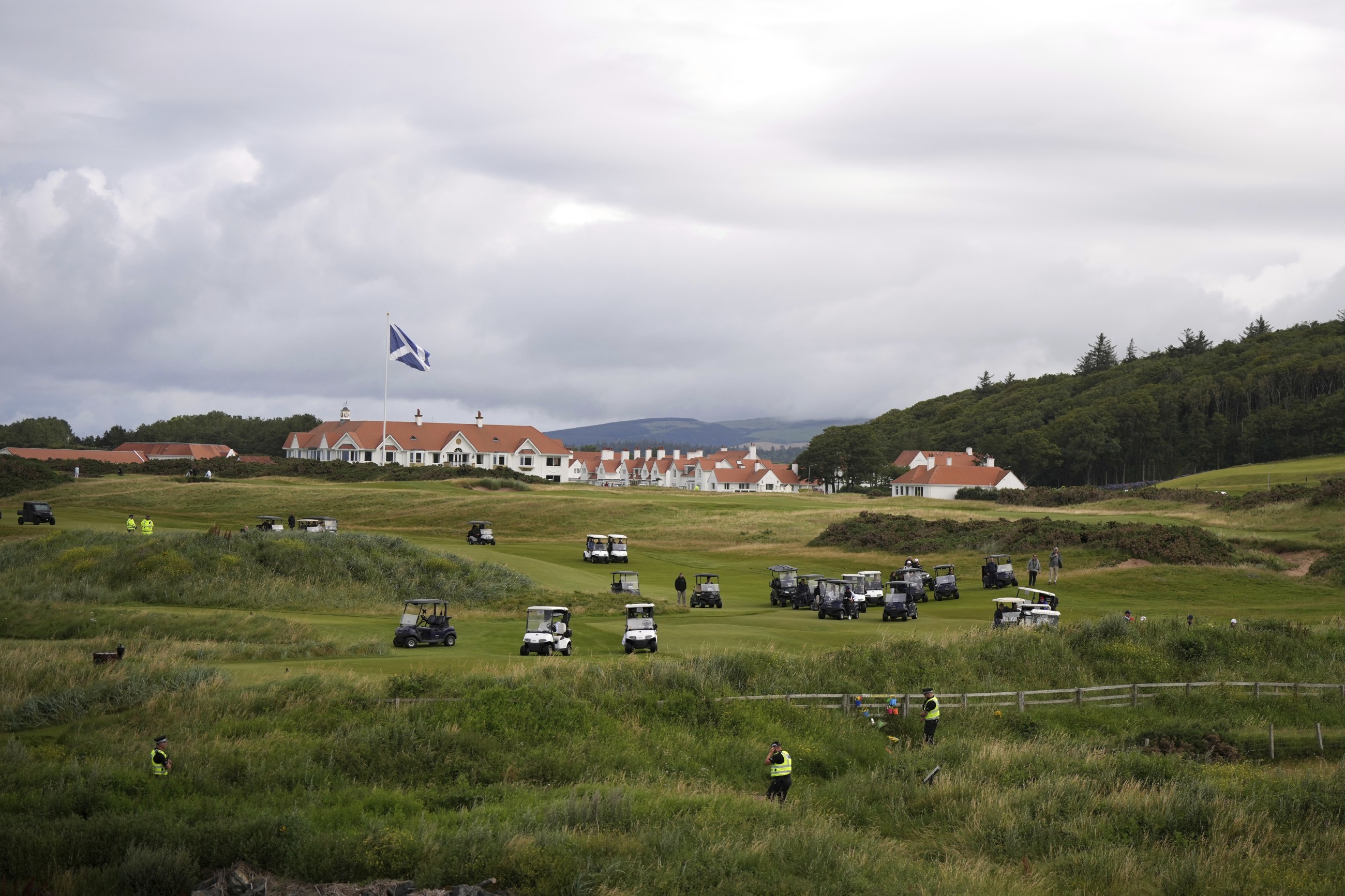 Trump plays golf in Scotland while protesters take to the streets and decry his visit