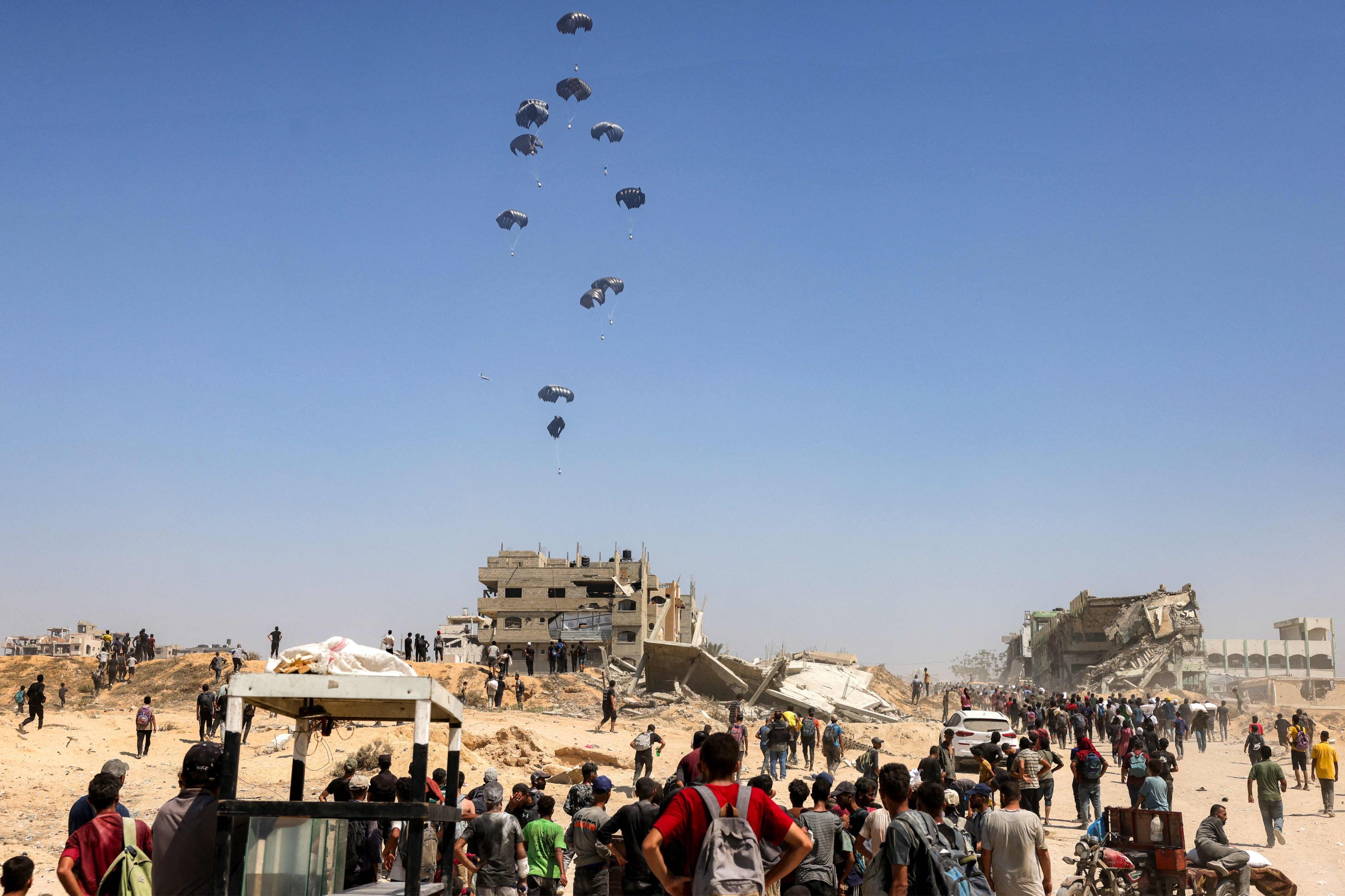 Israel announces daily pauses in Gaza fighting as aid airdrops begin