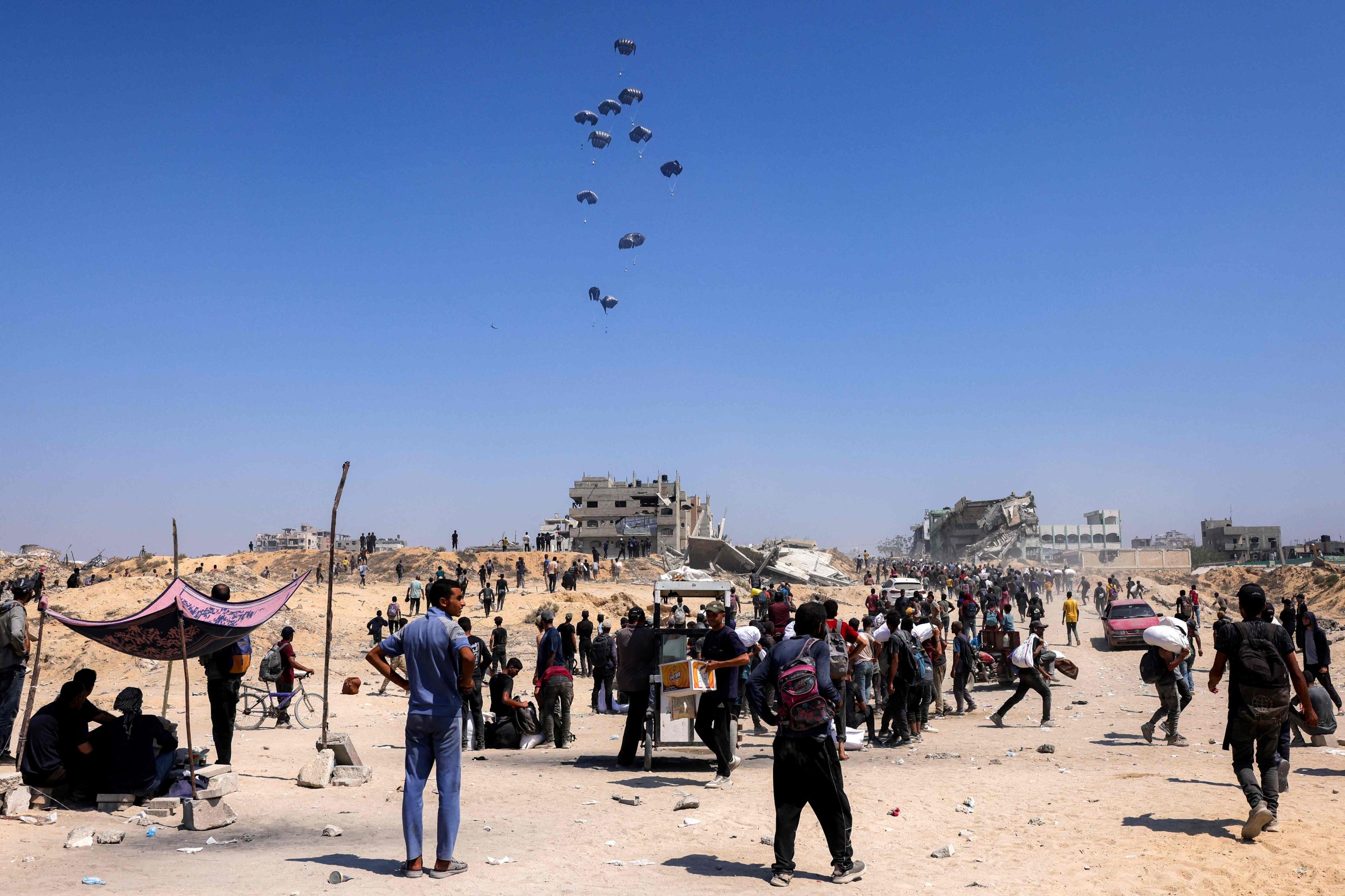 Israel announces daily pauses in Gaza fighting as aid airdrops begin