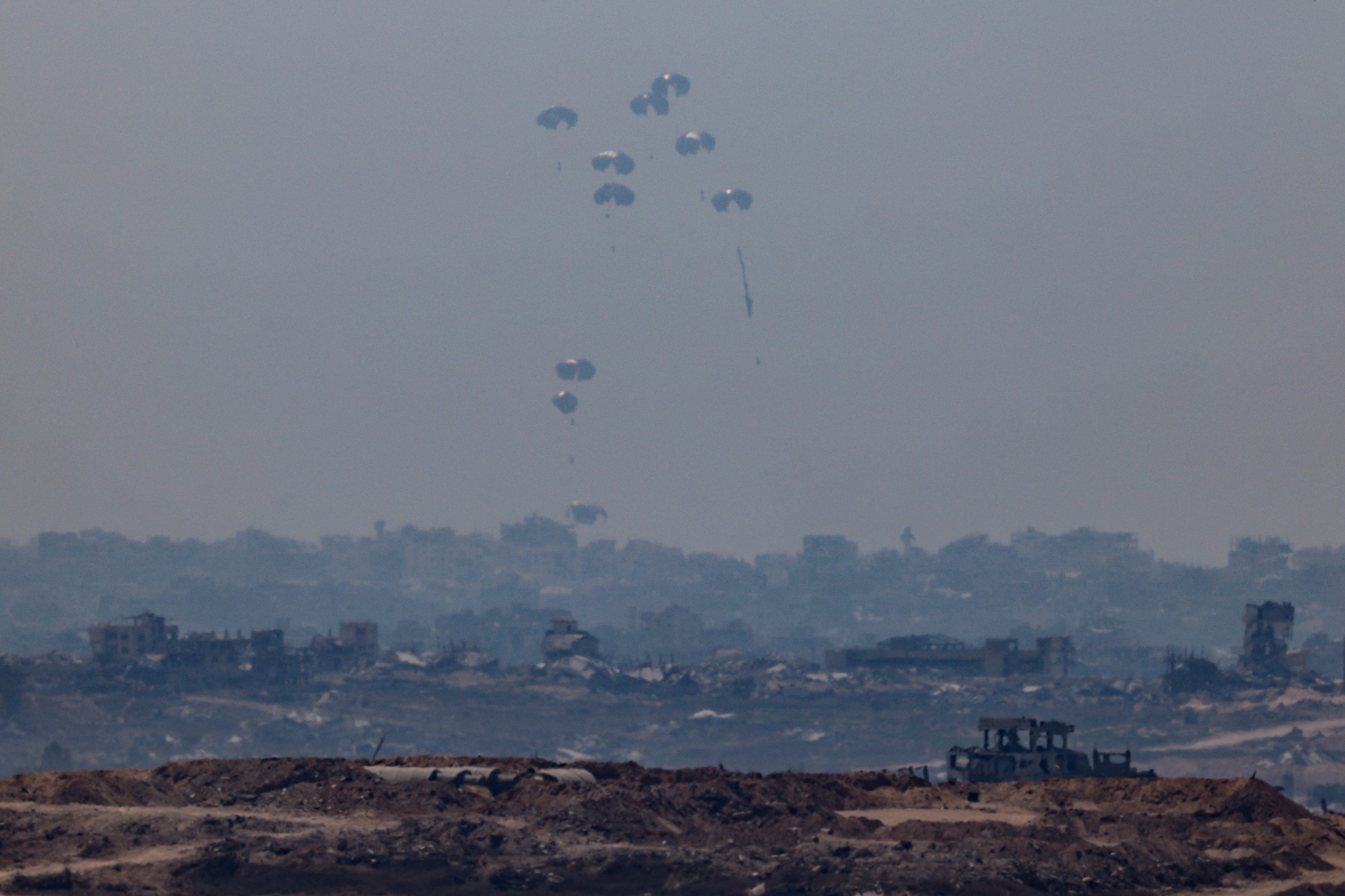 Israel announces daily pauses in Gaza fighting as aid airdrops begin