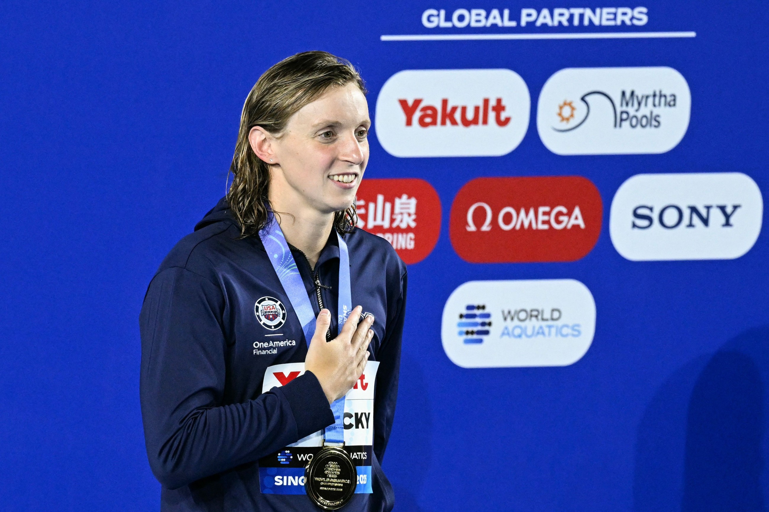 Americans set relay world record in swim worlds in Singapore, Ledecky wins again