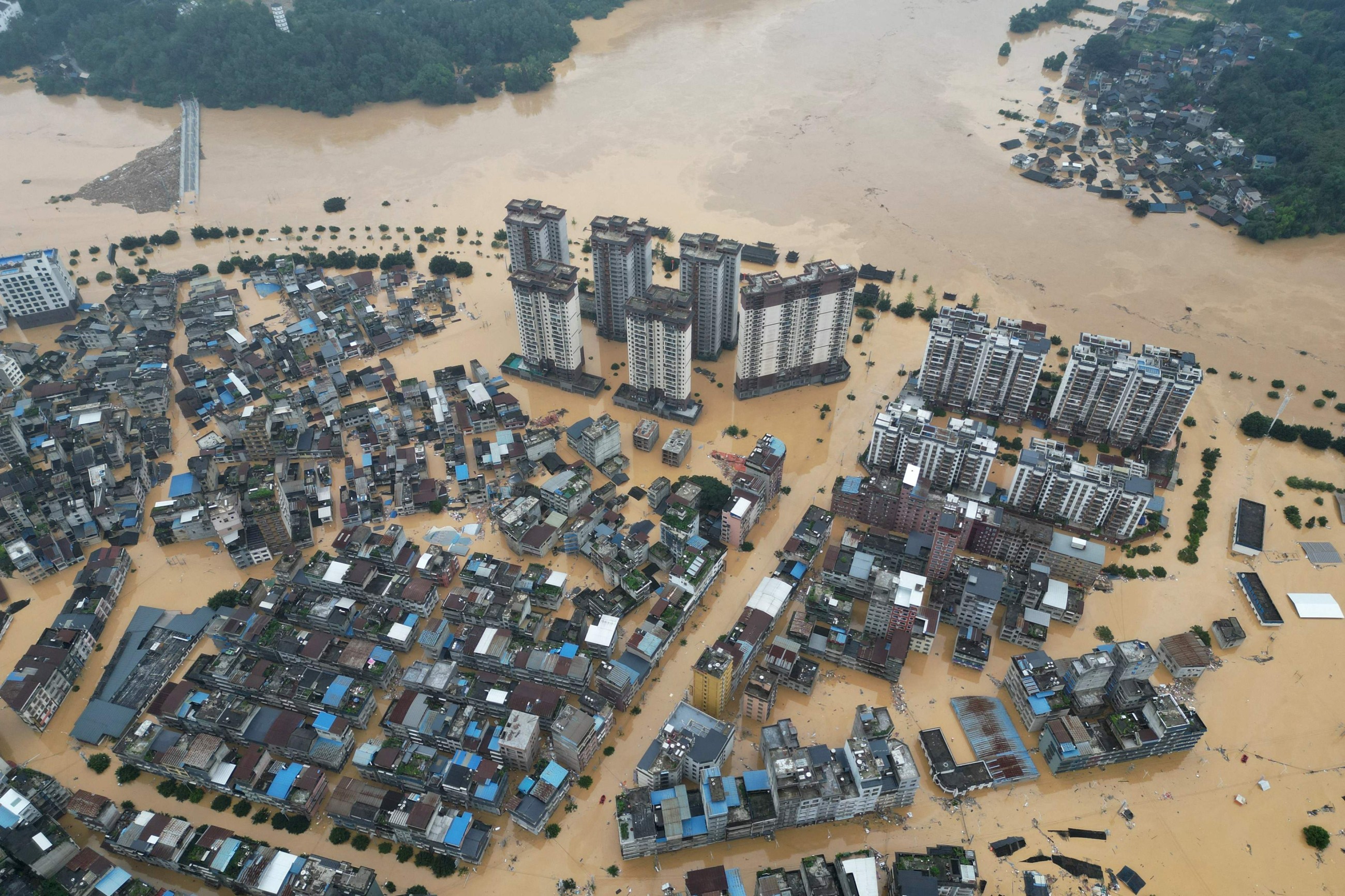 Beijing issues new storm warning after deadly floods