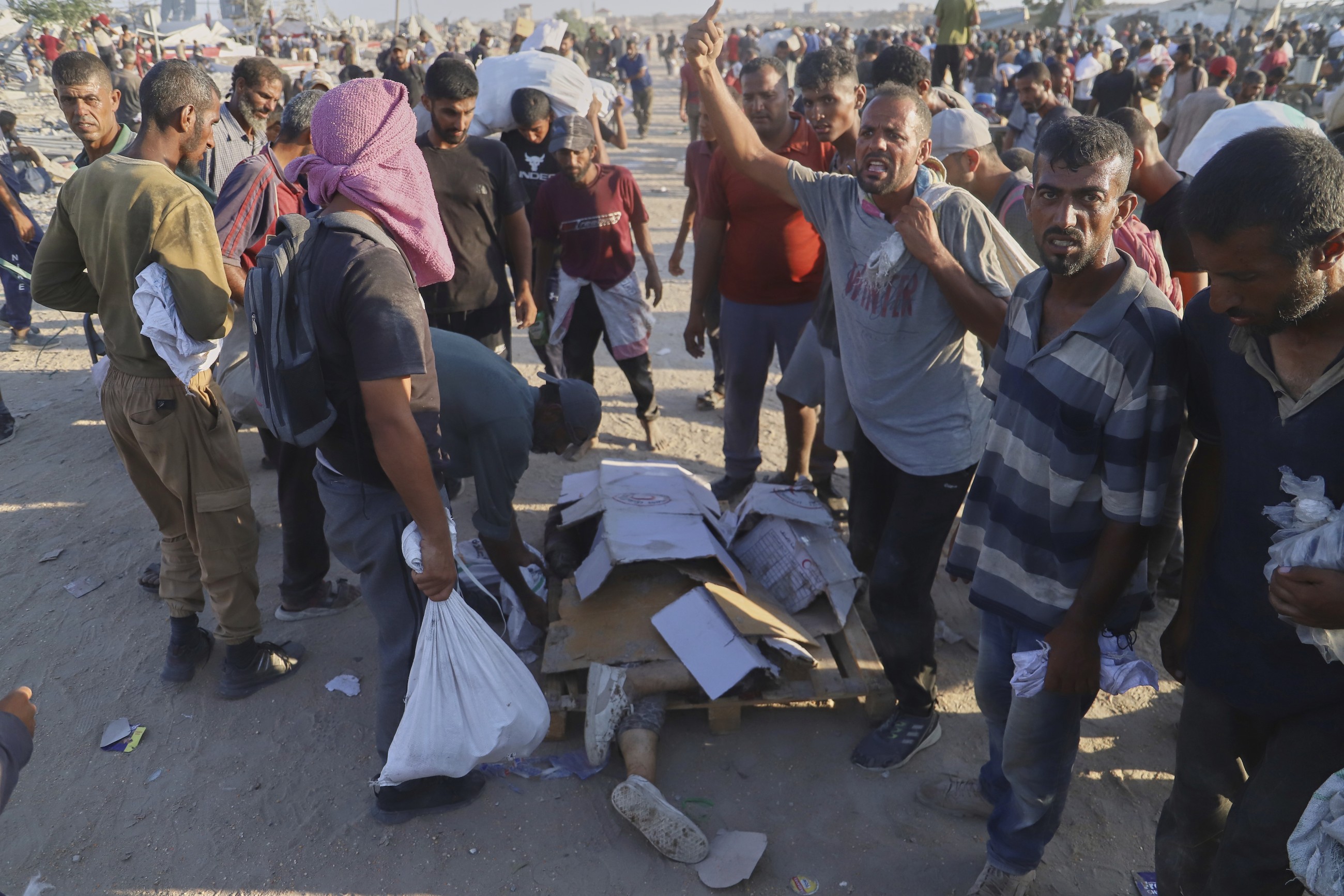 Dozens killed as Palestinians in Gaza scramble for aid from air and land