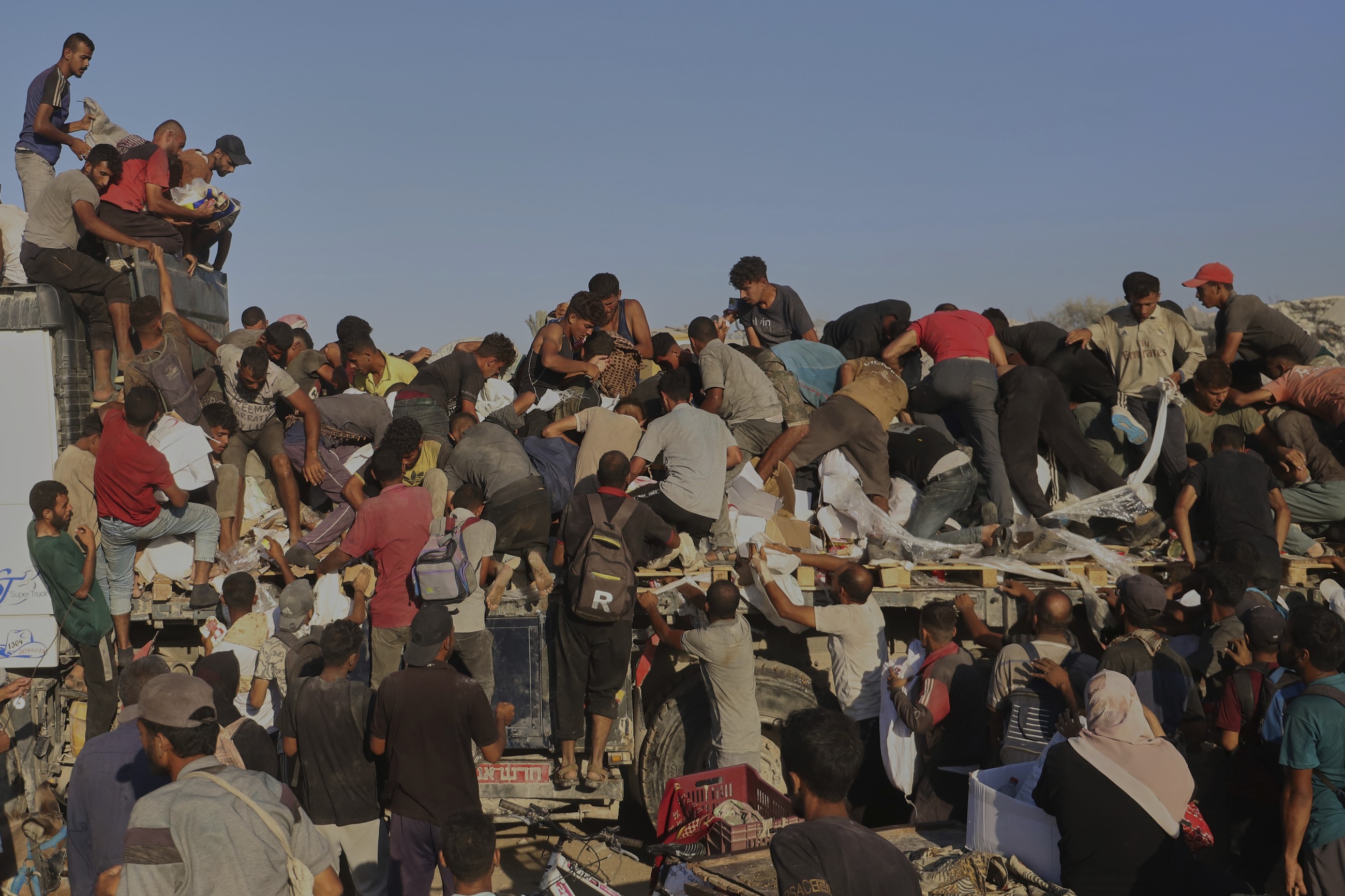 Dozens killed as Palestinians in Gaza scramble for aid from air and land