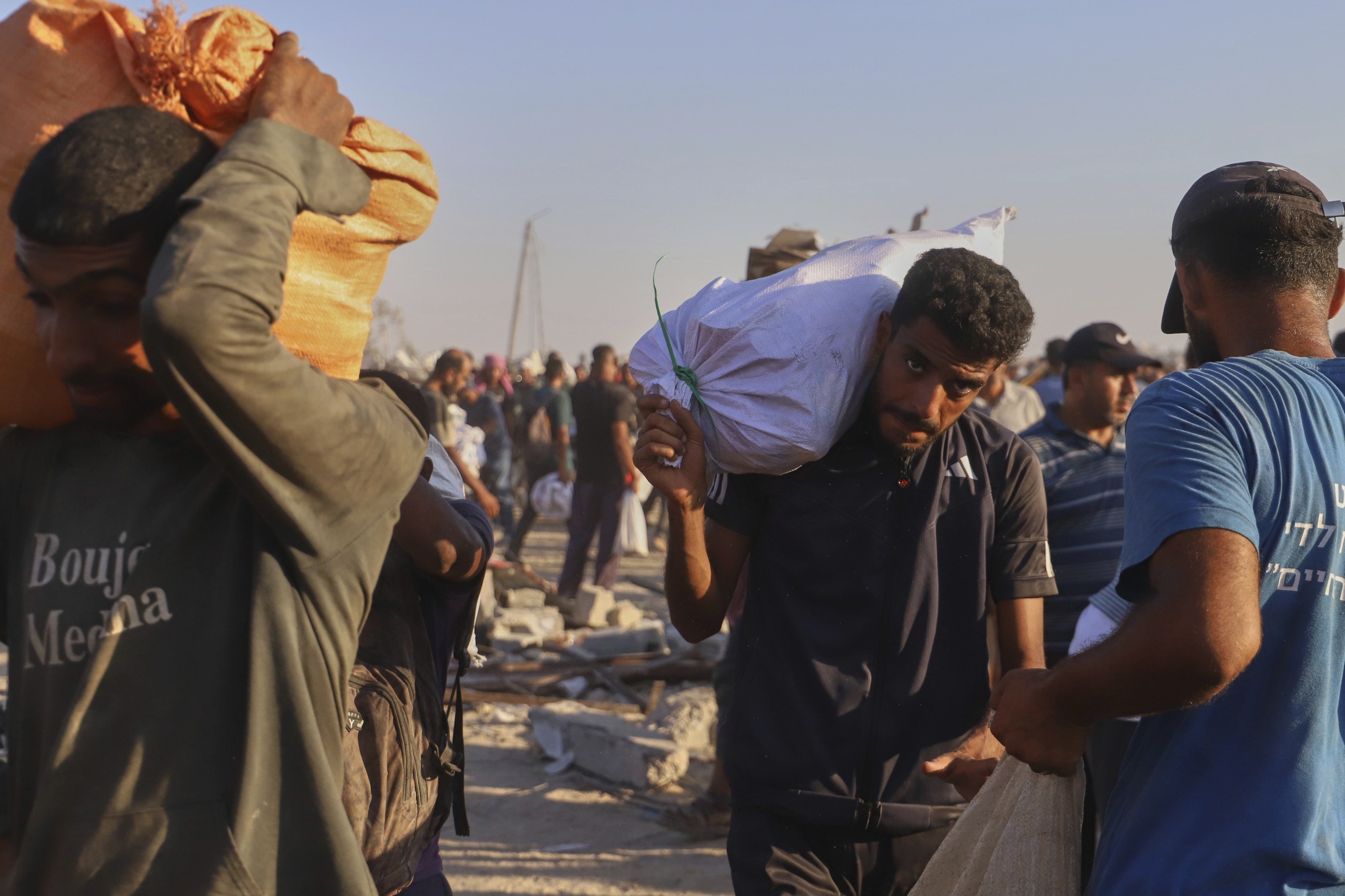 Dozens killed as Palestinians in Gaza scramble for aid from air and land