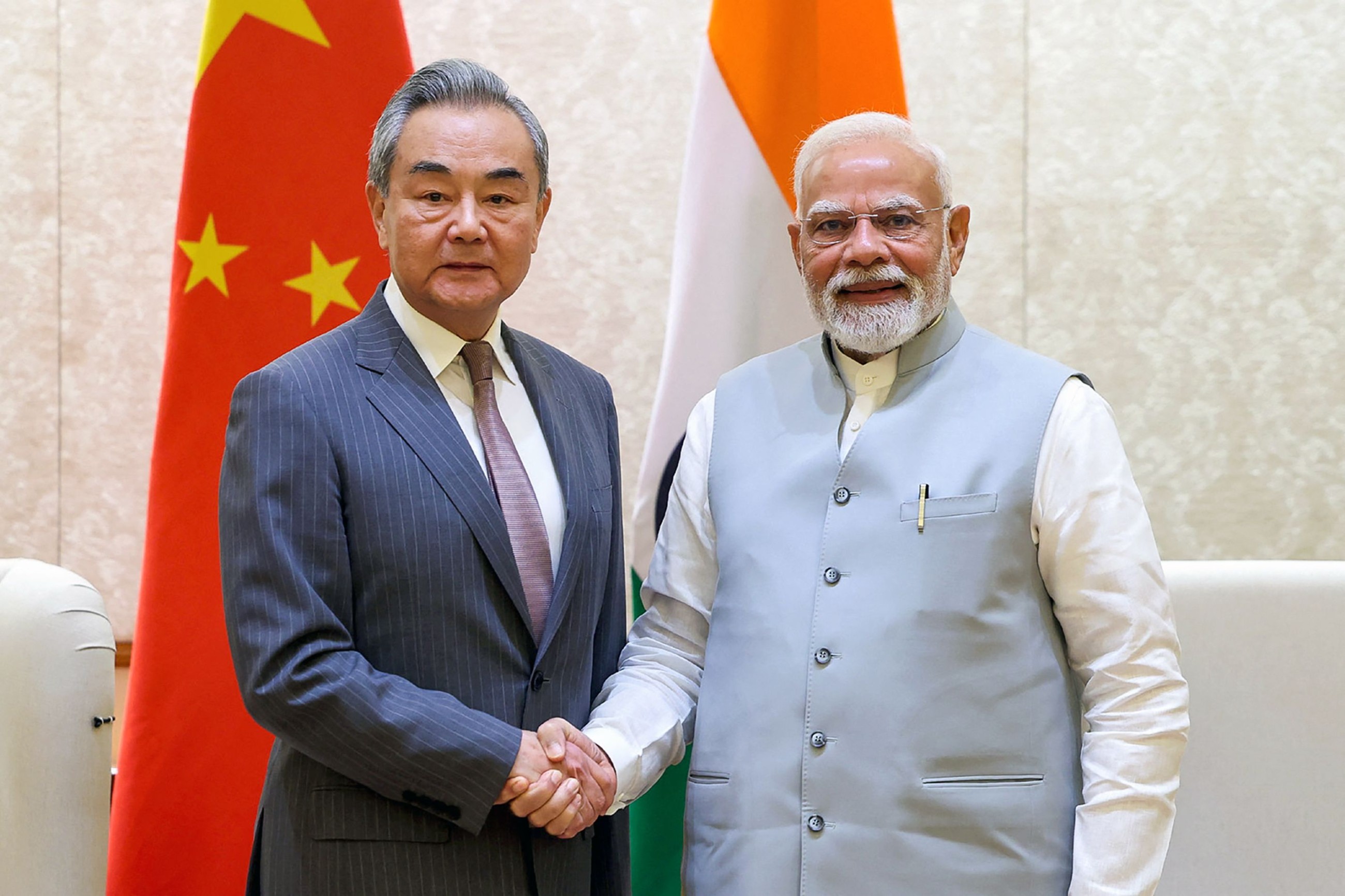 India and China to boost business links, agree to resume direct flights