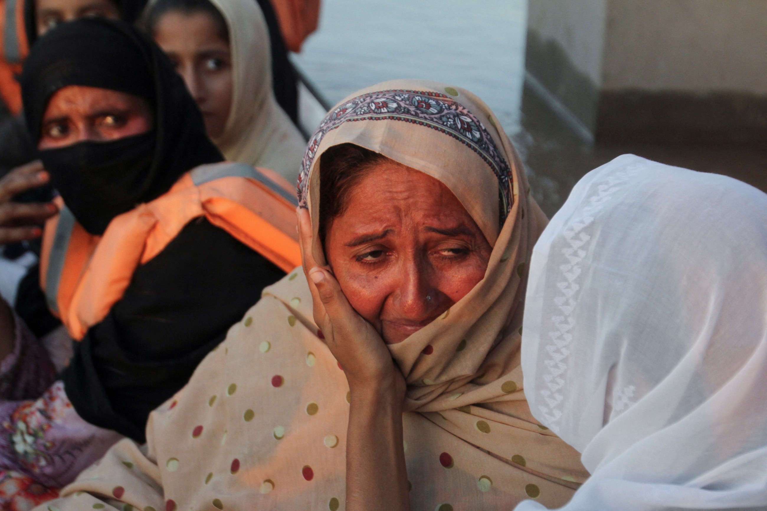 Rescuers in Pakistan scramble to save residents