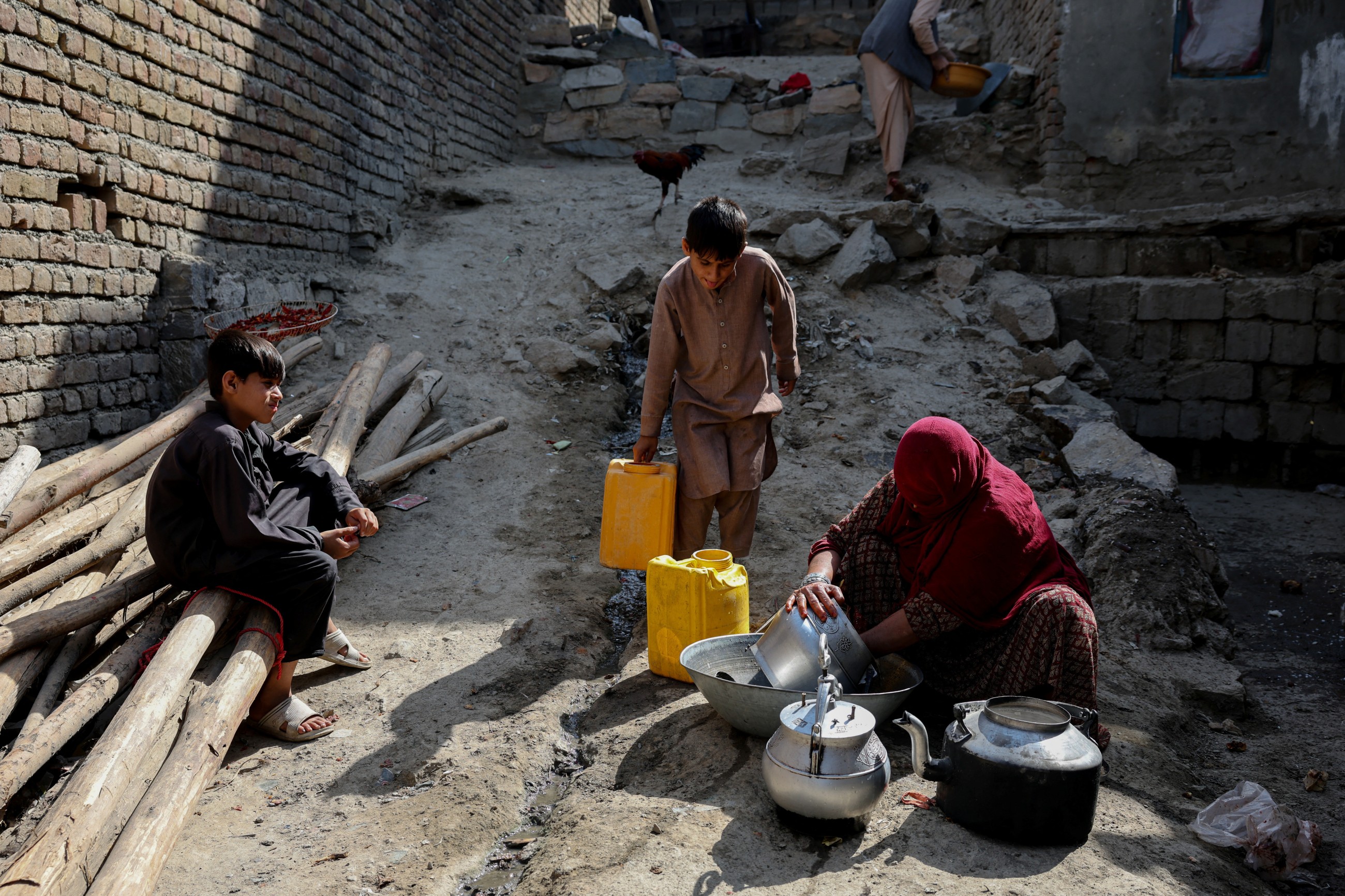 Water is life: Afghan capital's wells run dry, driving children out of class and into water queues