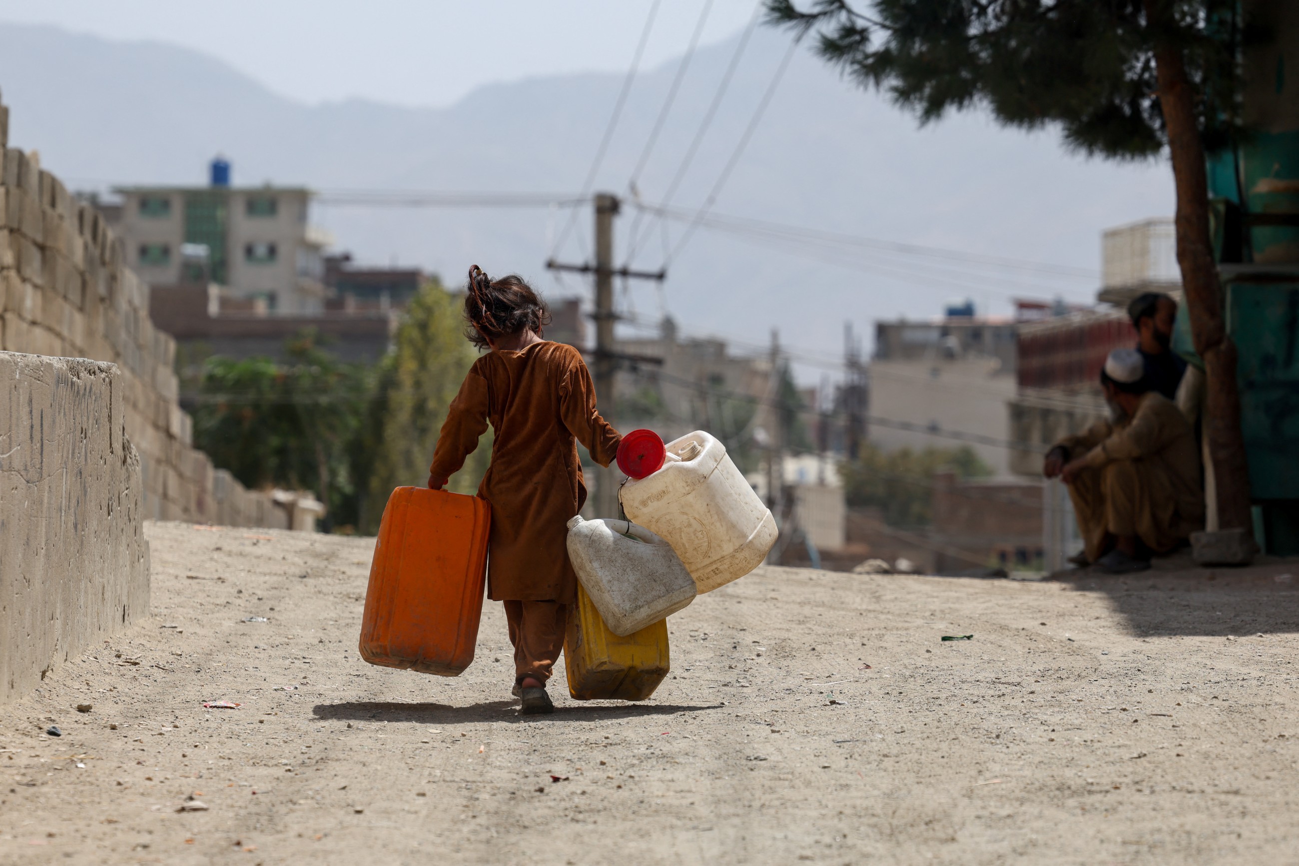 Water is life: Afghan capital's wells run dry, driving children out of class and into water queues