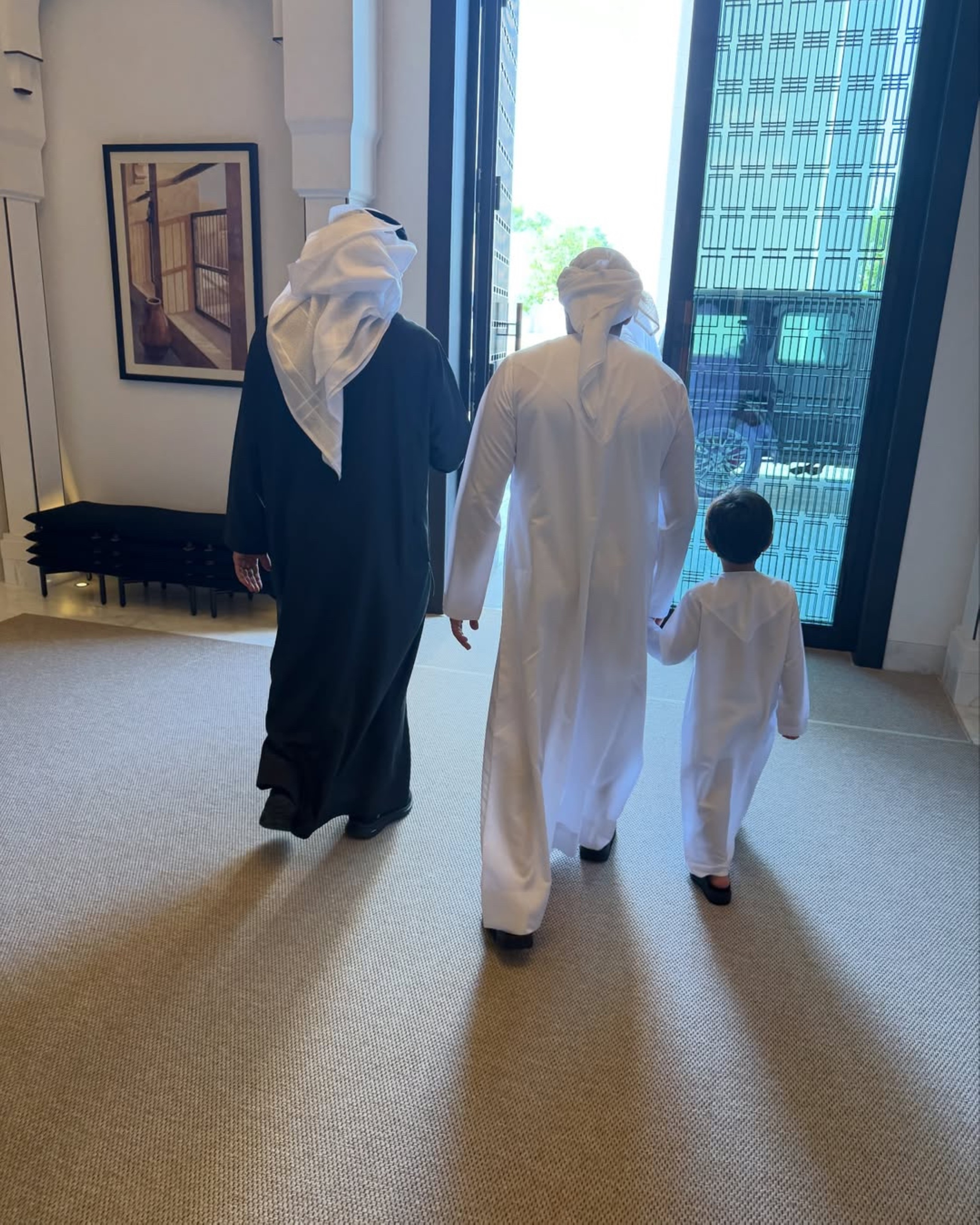 Sheikh Mohamed Bin Zayed, Sheikh Hamdan and his son.walk towards the courtyard. 