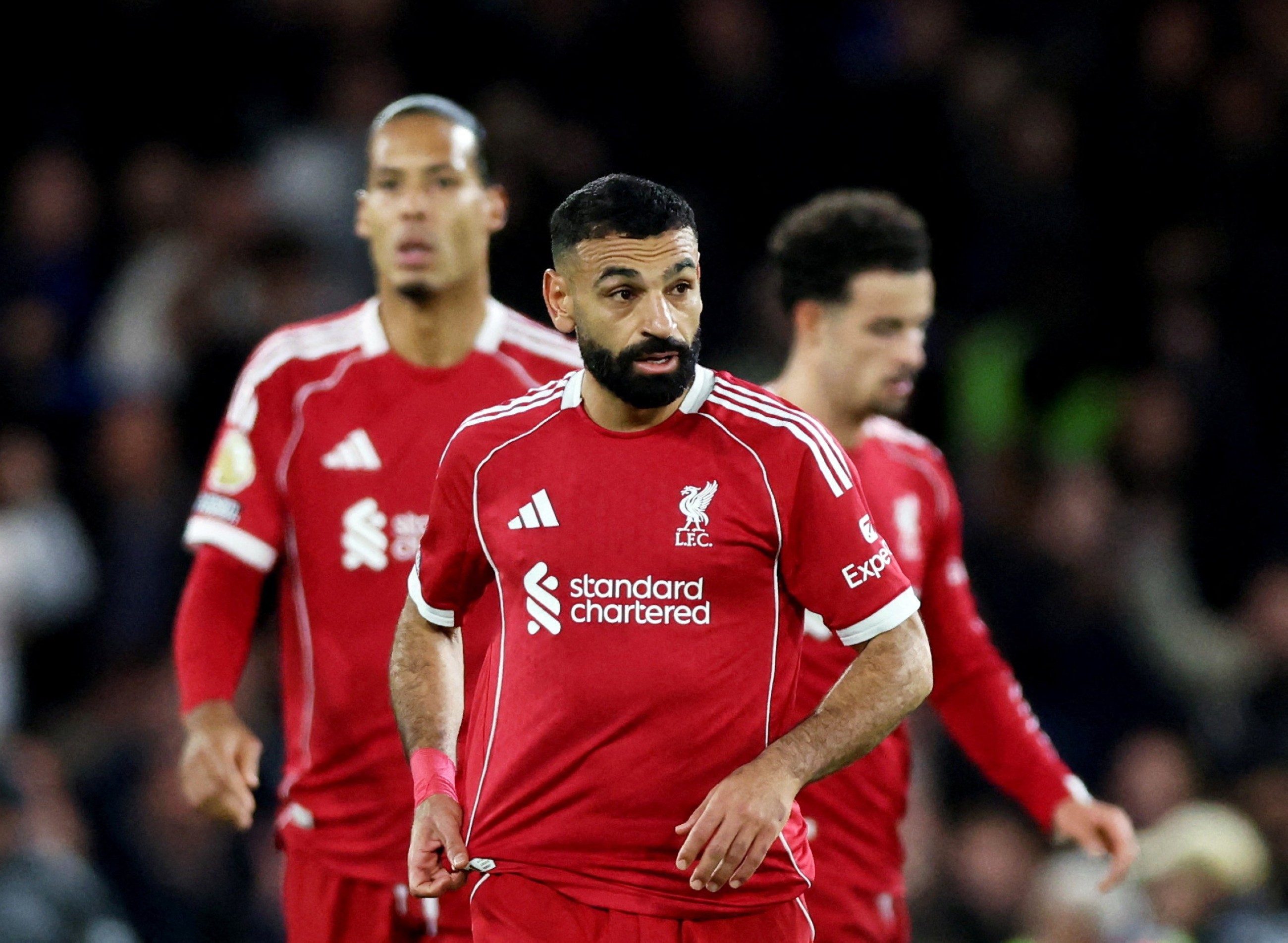 Mohamed Salah looks dejected with Virgil van Dijk and Curtis Jones after the match.