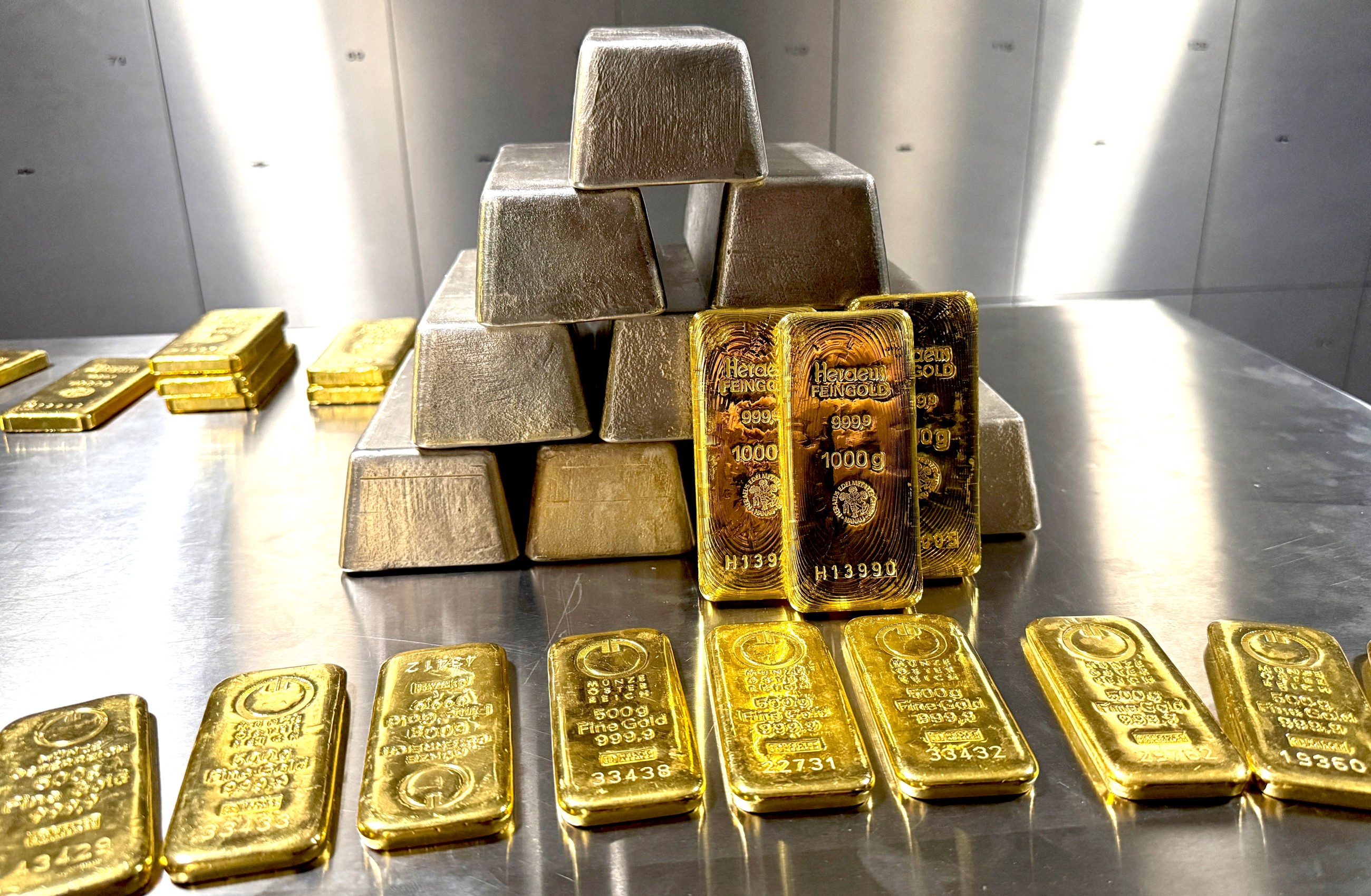 Gold and silver bars are stacked in the safe deposit boxes room of the Pro Aurum gold house in Munich, Germany.