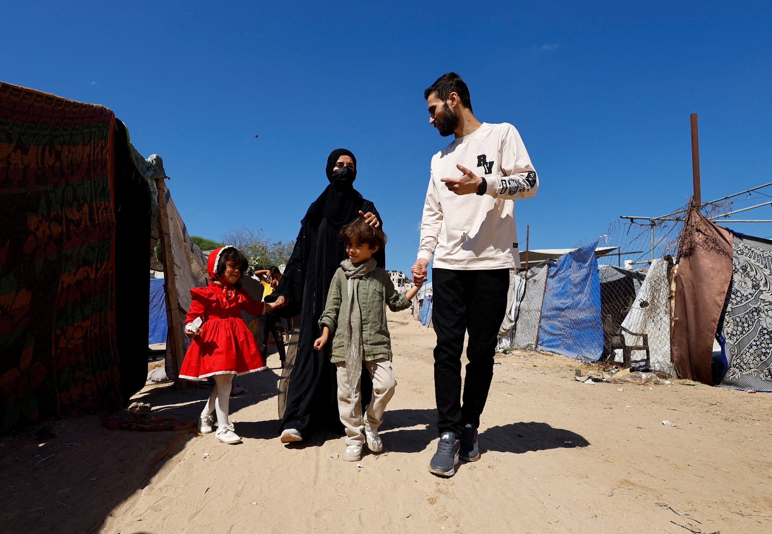 Freed Gaza photographer overjoyed to find family alive after being told in Israeli jail they were dead