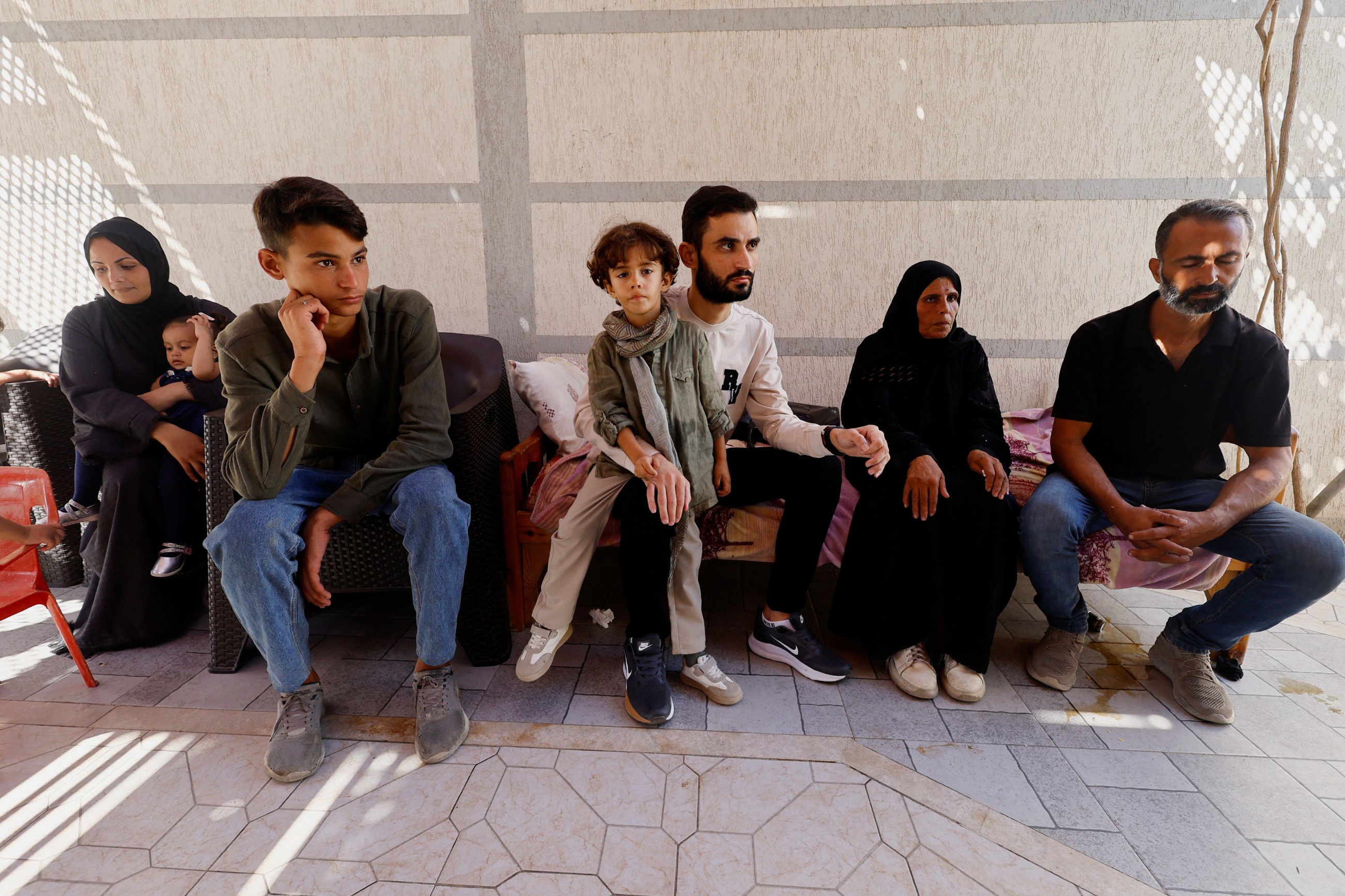 Freed Gaza photographer overjoyed to find family alive after being told in Israeli jail they were dead