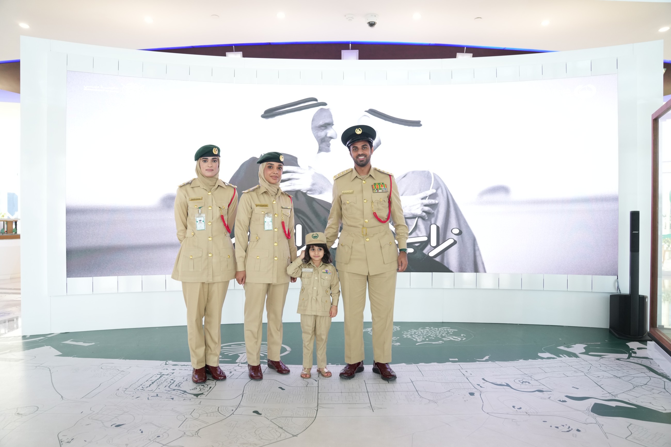 Sara Nabil Ahmadi poses for a photograph with Dubai Police officers. 
