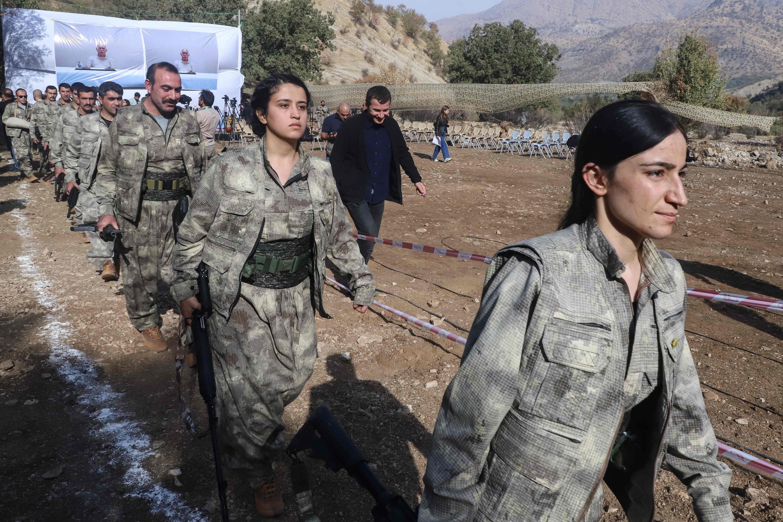 PKK fighters arrive to attend a ceremony in the Qandil area of northern Iraq on Sunday. AFP