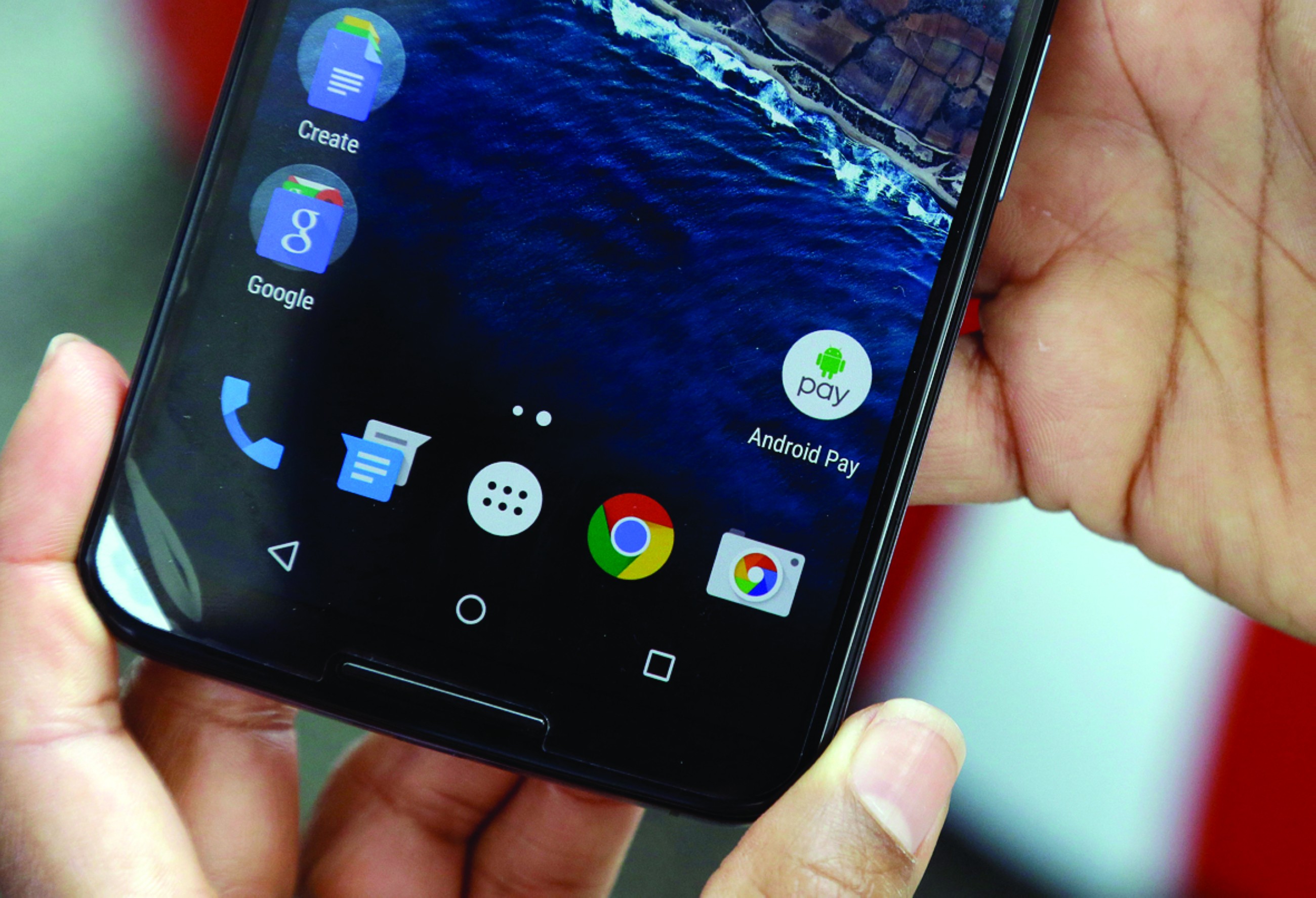 A picture shows the icon for the Android Pay app on a phone.