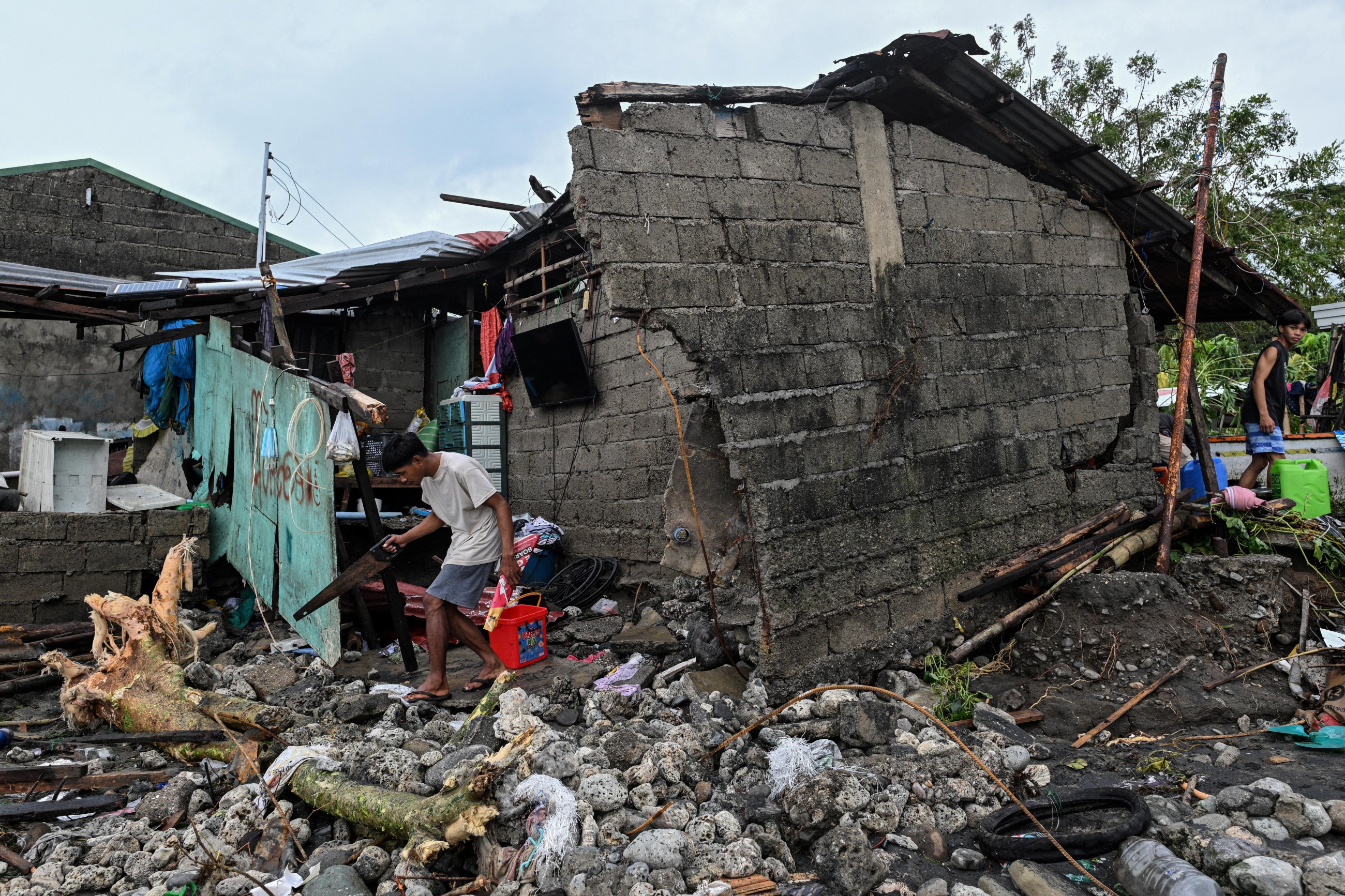 Philippines digs out from Typhoon Fung-wong as death toll climbs to 18