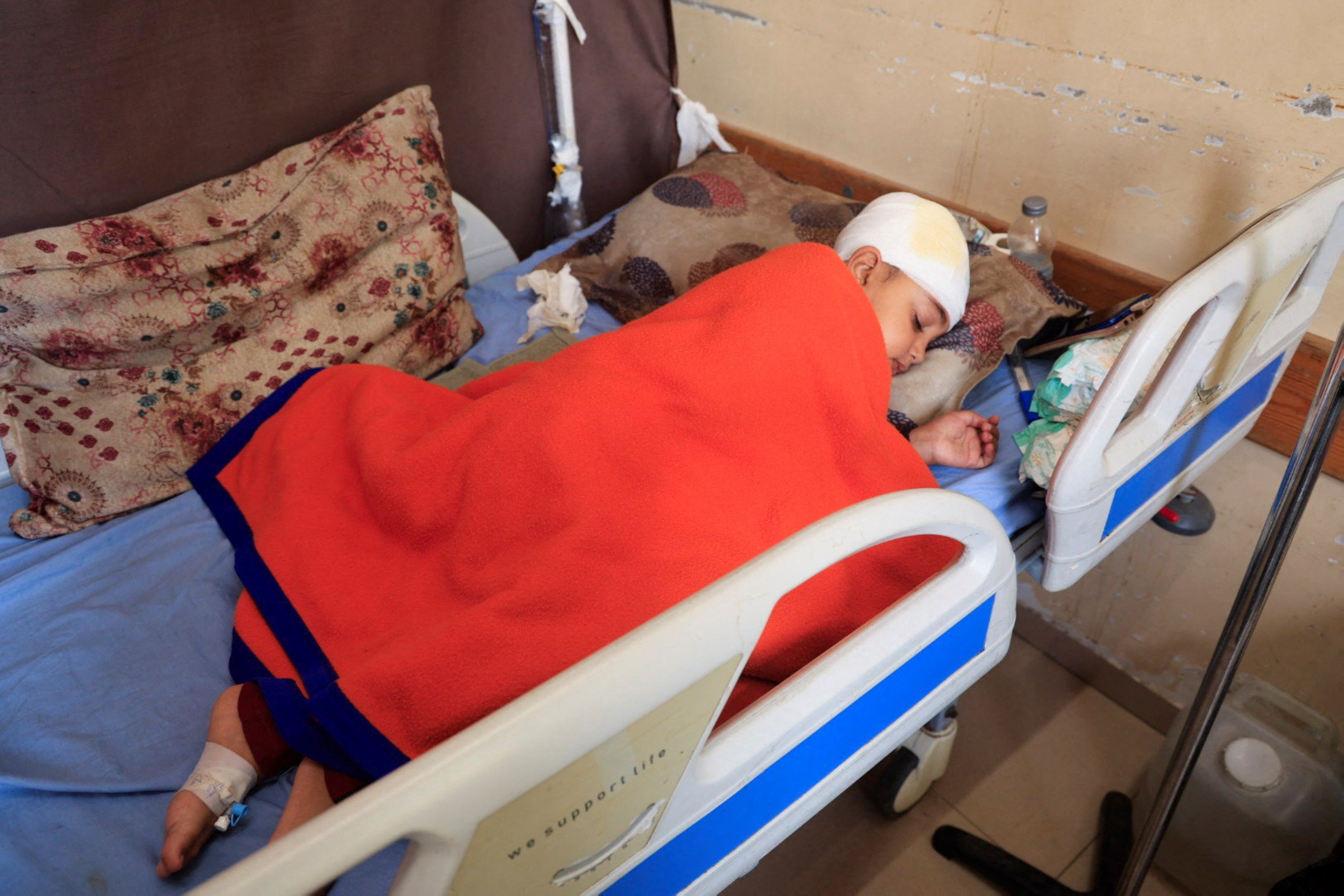 Gaza patients face a painful wait as hospitals sag under burden of cases