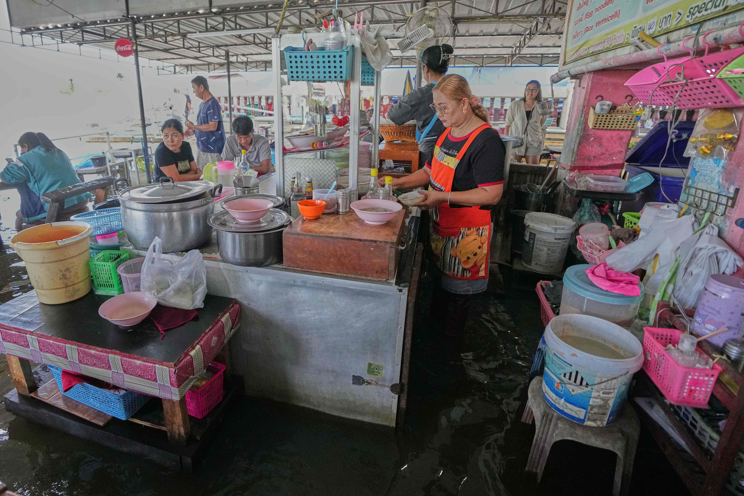 ‘Flooded restaurant’ brings delight with swimming fish among diners