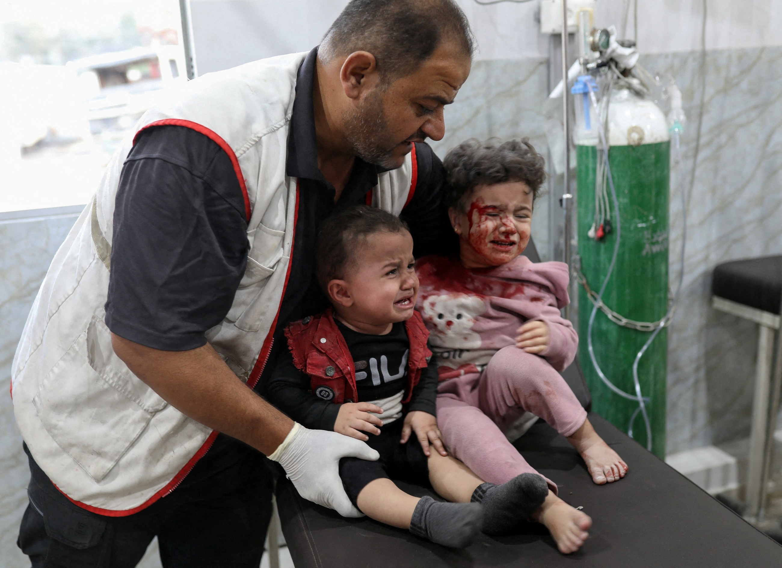 Israel launches strikes in Gaza ceasefire's latest test as hospitals say over 20 killed