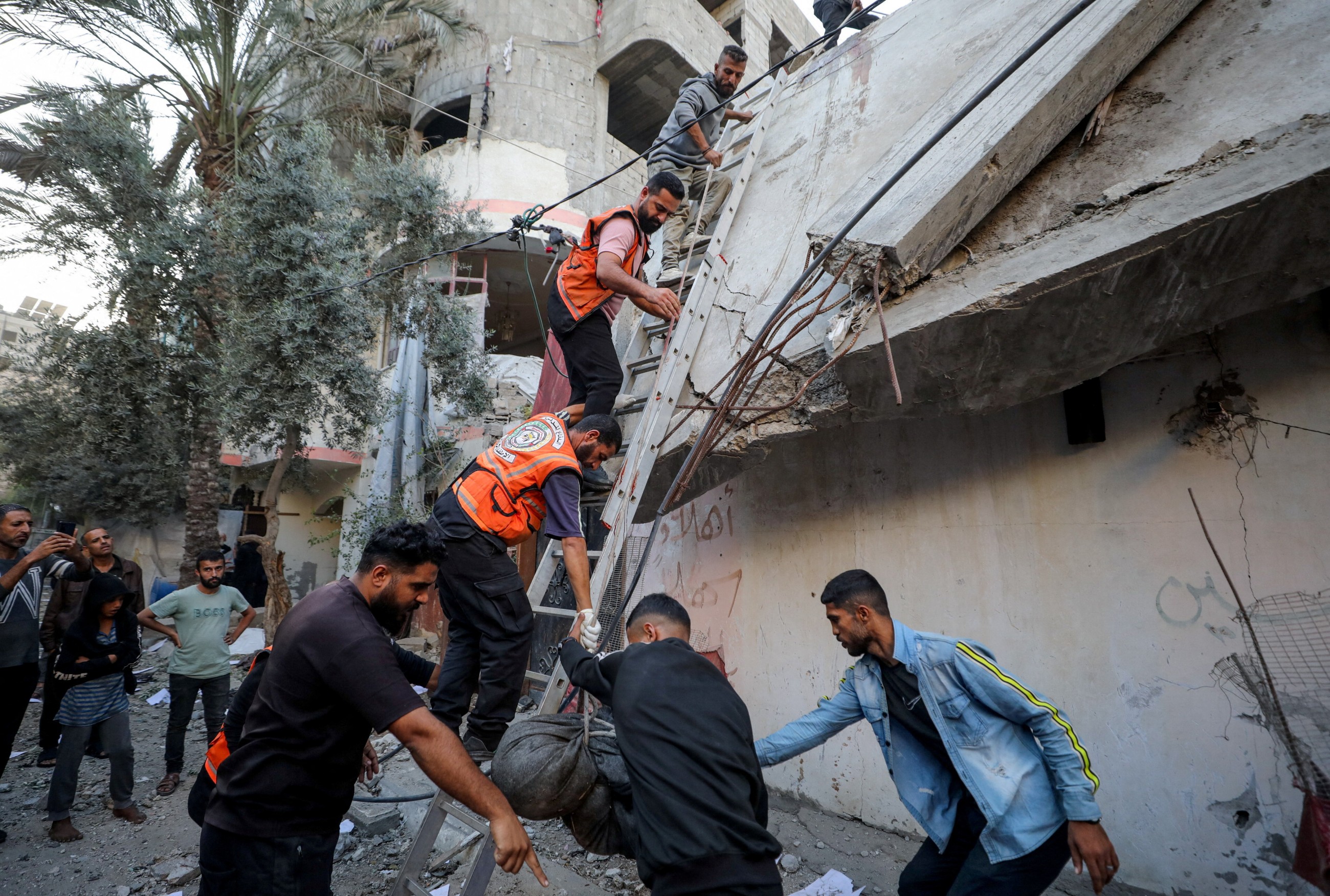 Israel launches strikes in Gaza ceasefire's latest test as hospitals say over 20 killed