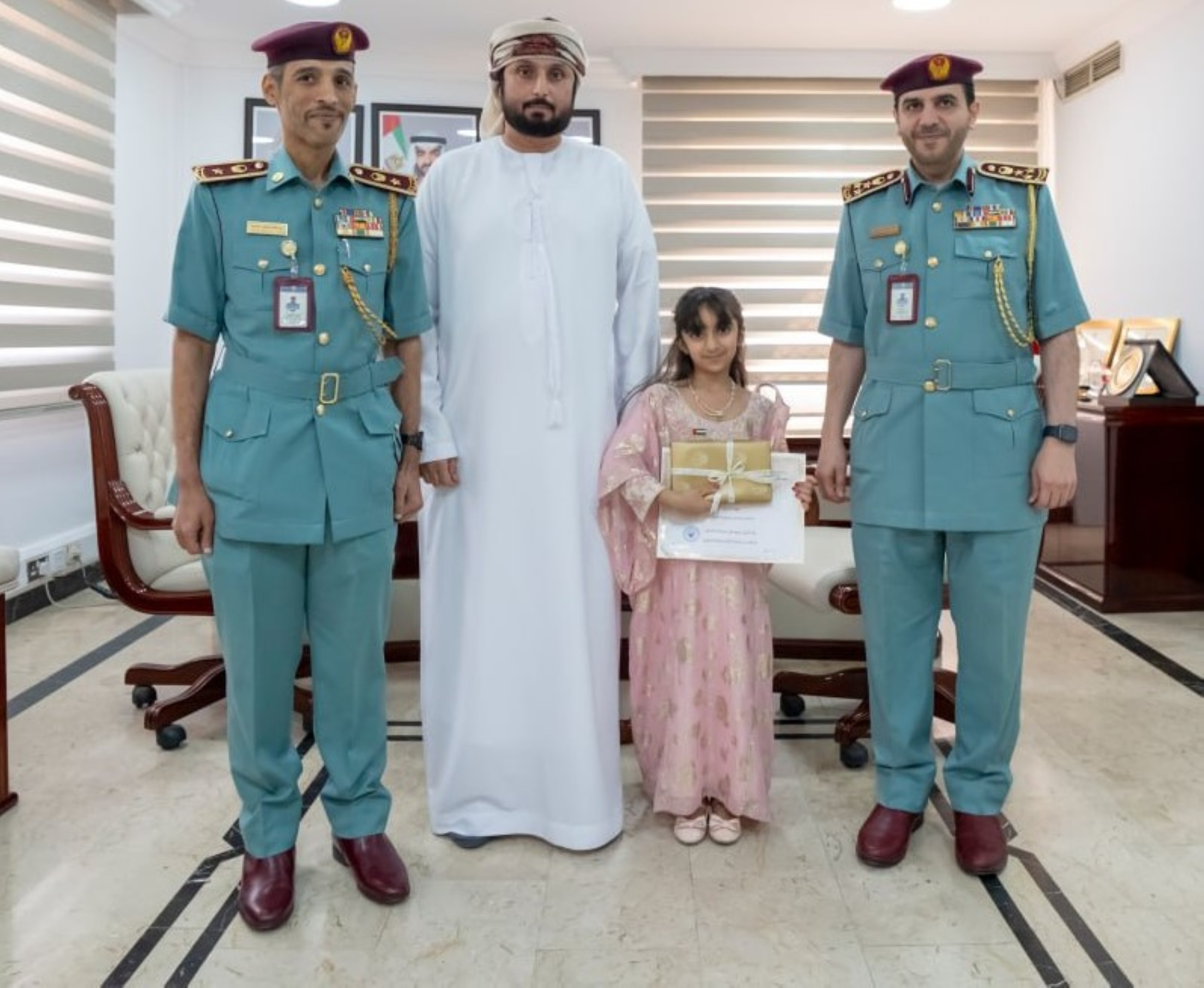 Ajman Police honour girl for handing over money she found at a public place