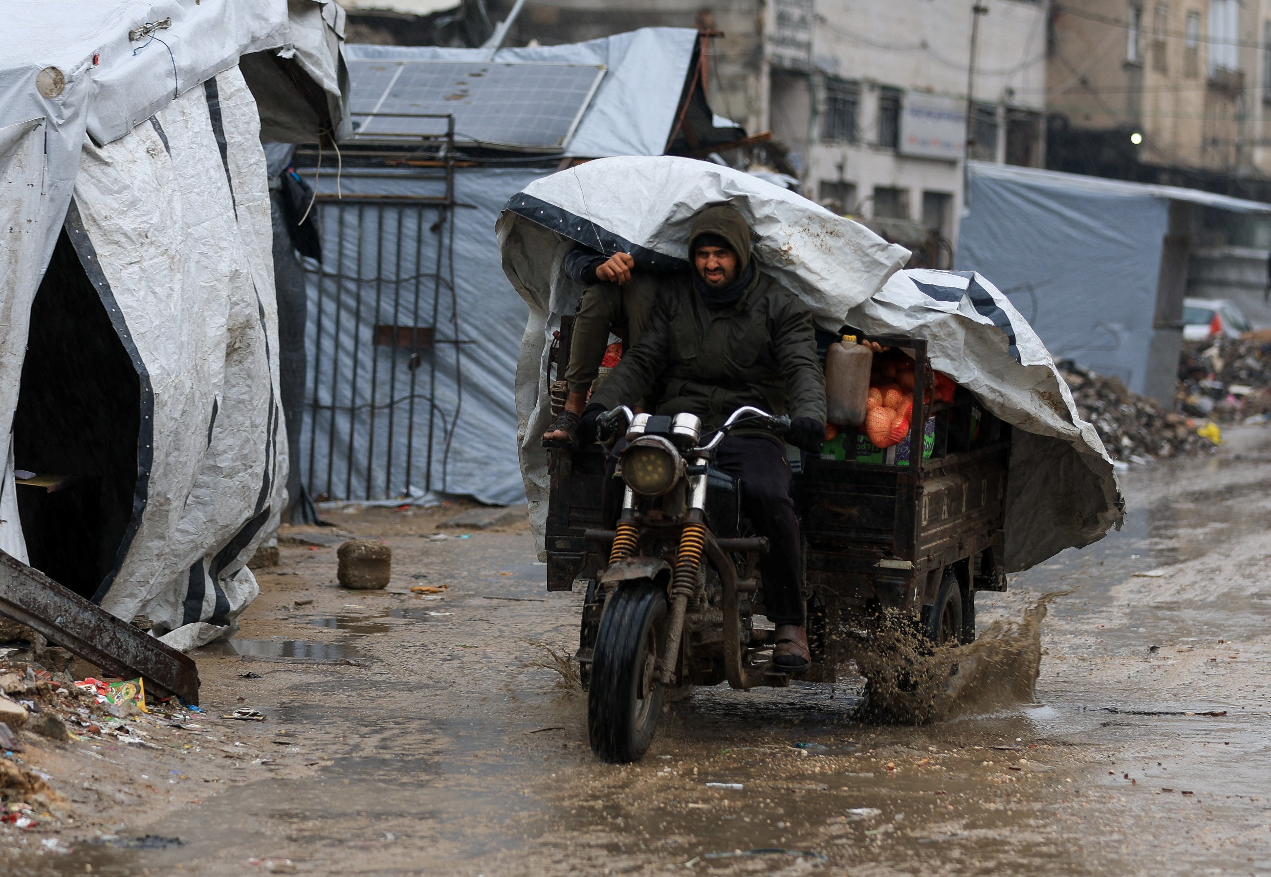 Rain has flooded Gaza tents and a baby died of exposure, say medics