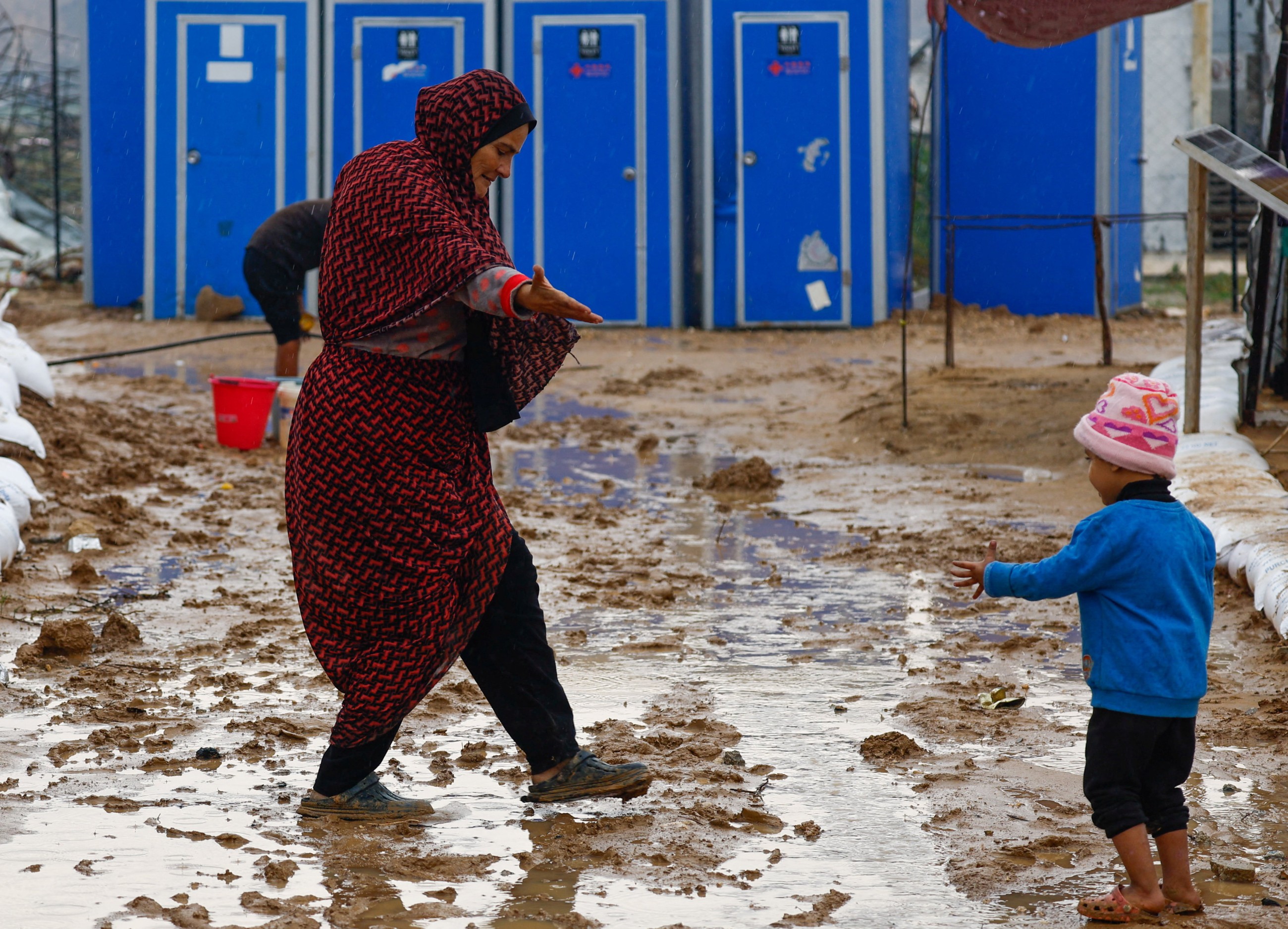 Rain has flooded Gaza tents and a baby died of exposure, say medics