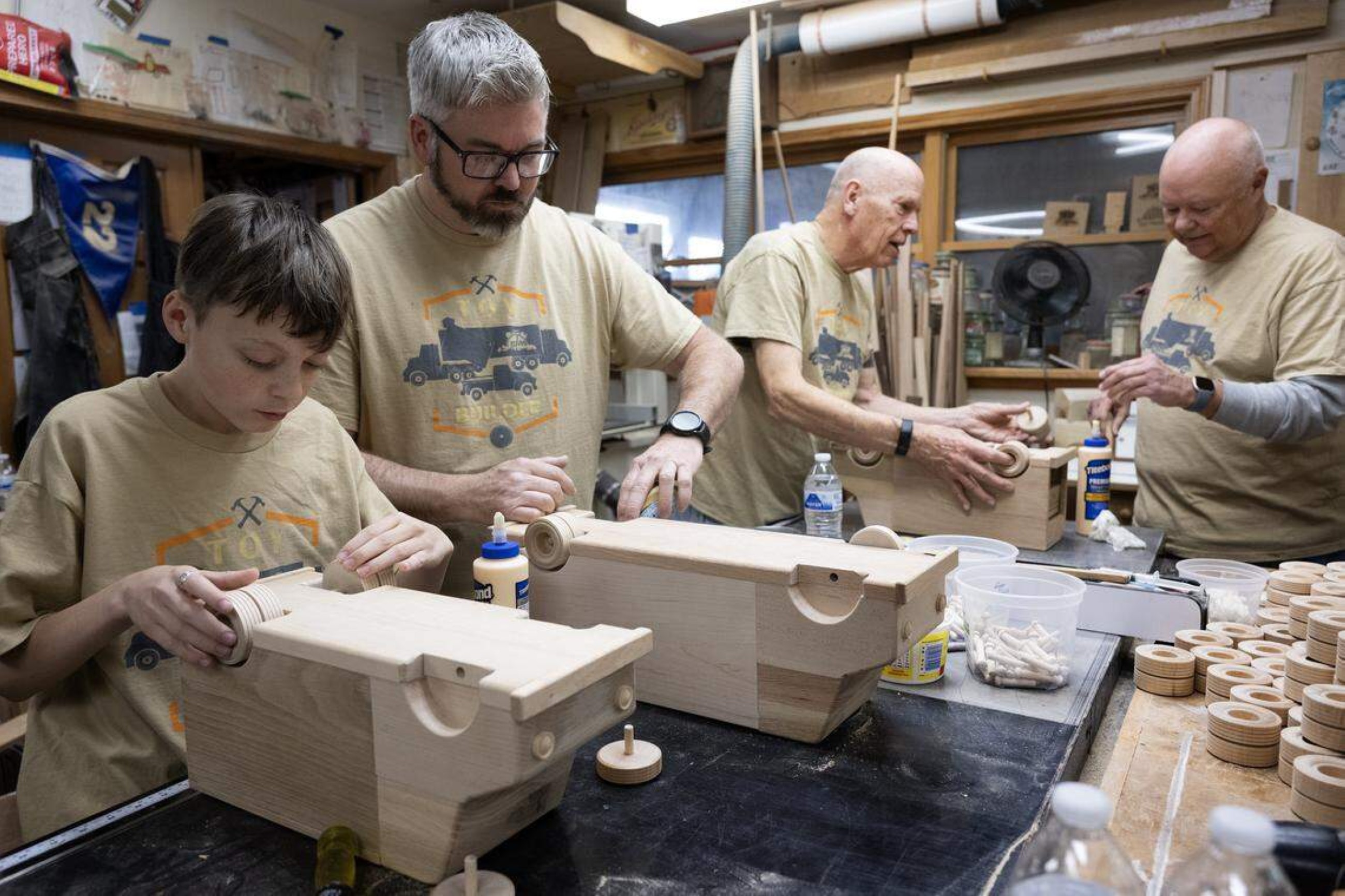 Volunteers use donated wood to craft gifts for kids